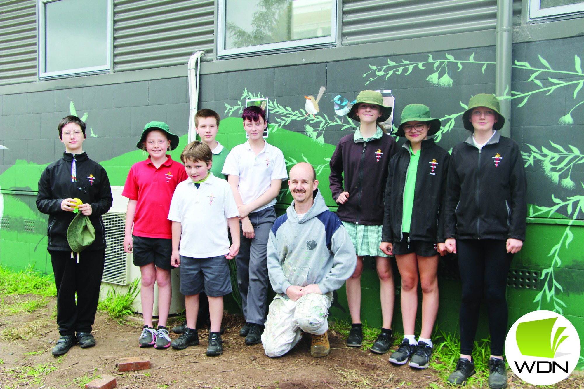 Artistic flair: A group of eight students at Mortlake P-12 College have begun work on a collaborative mural with well known artist Jimmi Buscombe.