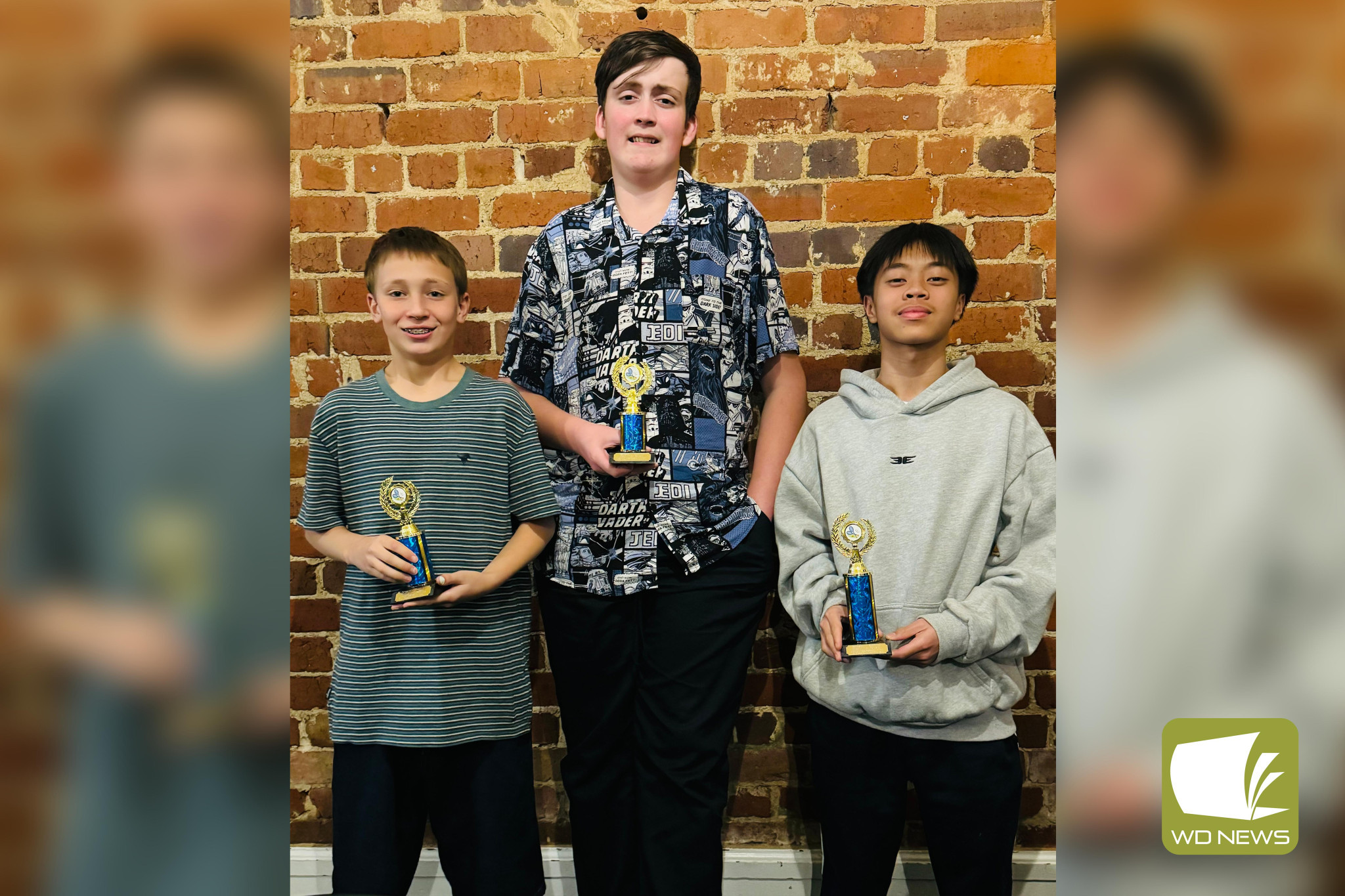 Junior winner Aidan Vallejo (right) with runners-up Orson Capizzi and Lenny Dubbins.