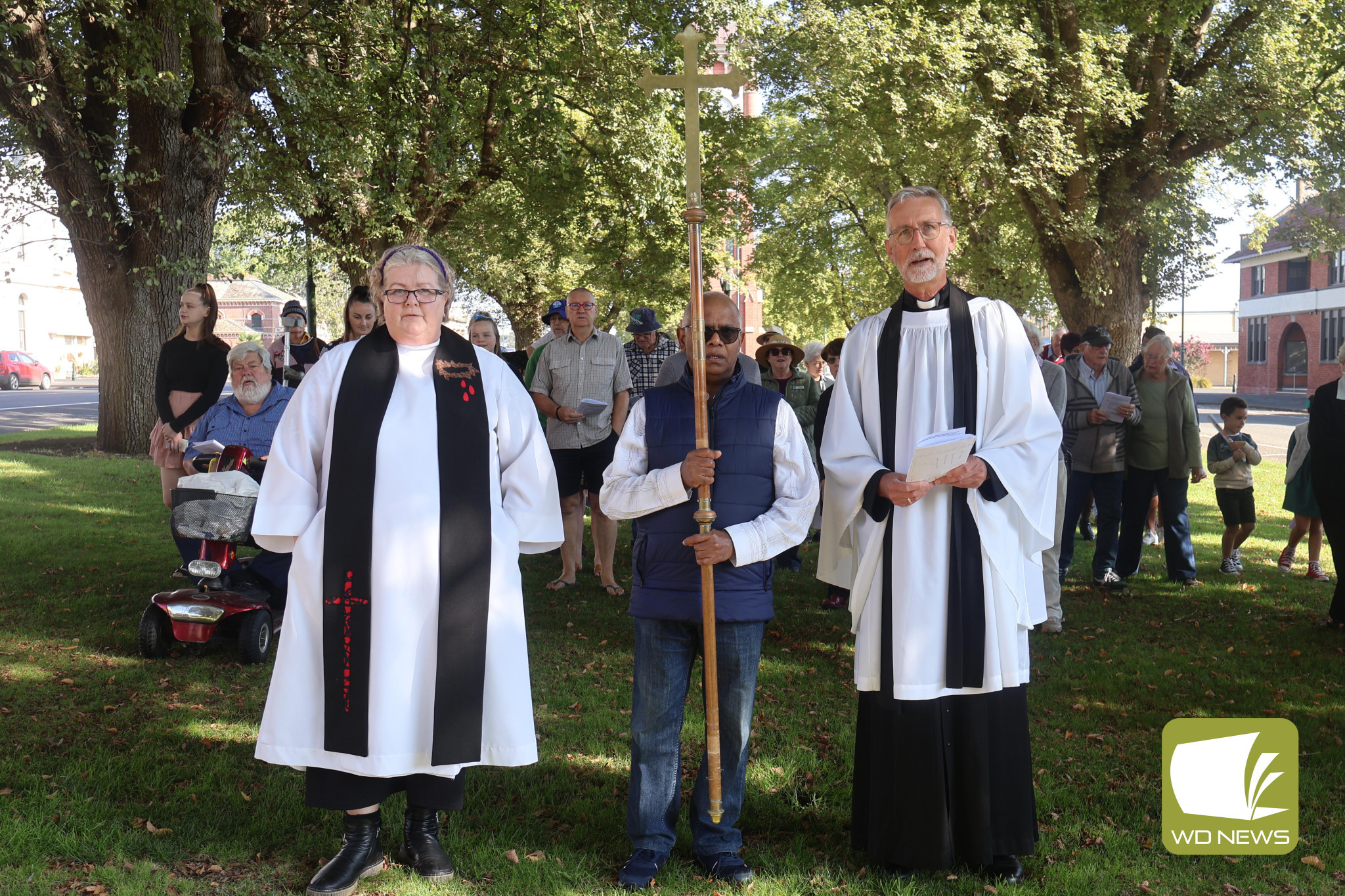 Way of the Cross: Reverends Suzie Castle, Neville Stanisulaus and Matthew Jones led the group of the faithful from the Post Office down to the Uniting Church.