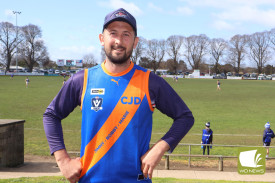 Terang Mortlake Football Netball Club president Joel Crawley shows off the guernsey the Bloods wore this weekend in a bid to raise awareness for Creutzfeldt-Jakob Disease.