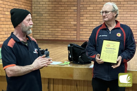 Indoor Bowls Warrnambool President Karl Keegan (left) presents Heytesbury Immediate Past President Allen Armistead with the 2024 South West Challenge trophy.