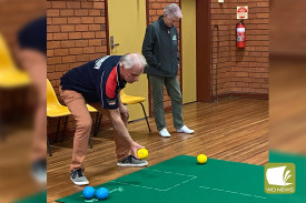 Simpson 1 Skip Gary Langenhuizen takes aim as Mepunga 2’s Skip Barb Draffen awaits her turn.