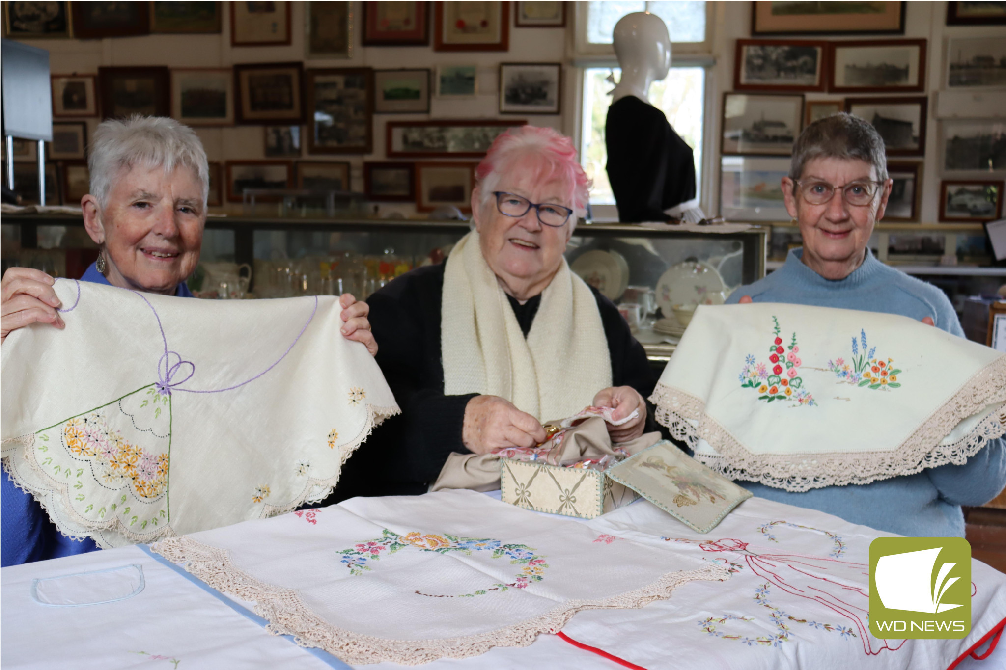 Restoration: Barbara Porter (middle) has been restoring embroidery for years. She is pictured with Janet Wayson (left), who she recently finished restoring a piece for, and Cobden Uniting Church Op Shop treasurer and joint manager Barbara Cowley (right).