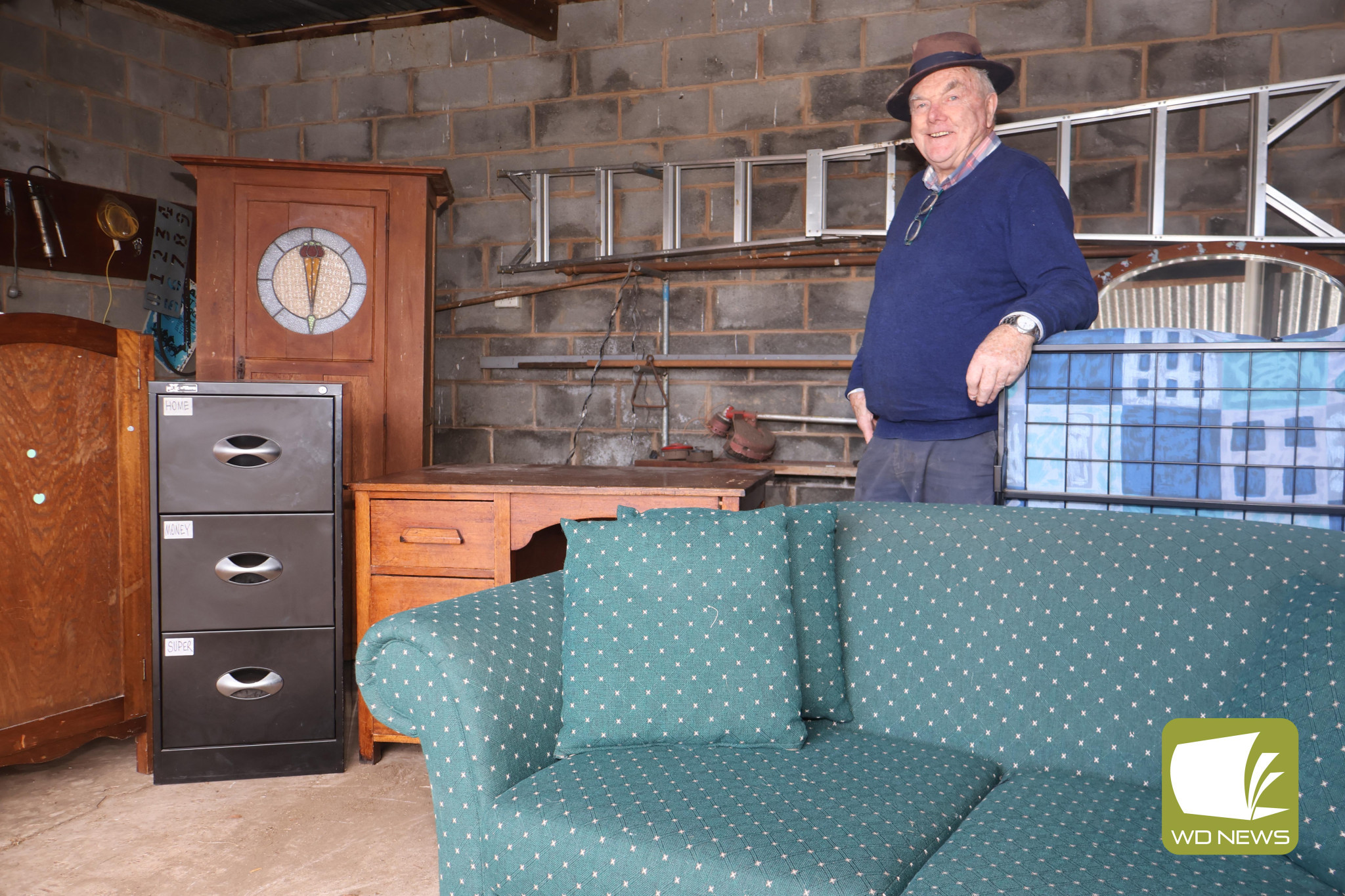 Up for grabs: St Vincent de Paul Terang/Mortlake Conference volunteer Des McKinnon, pictured with some of the furniture available, hopes to be able to help those in need.
