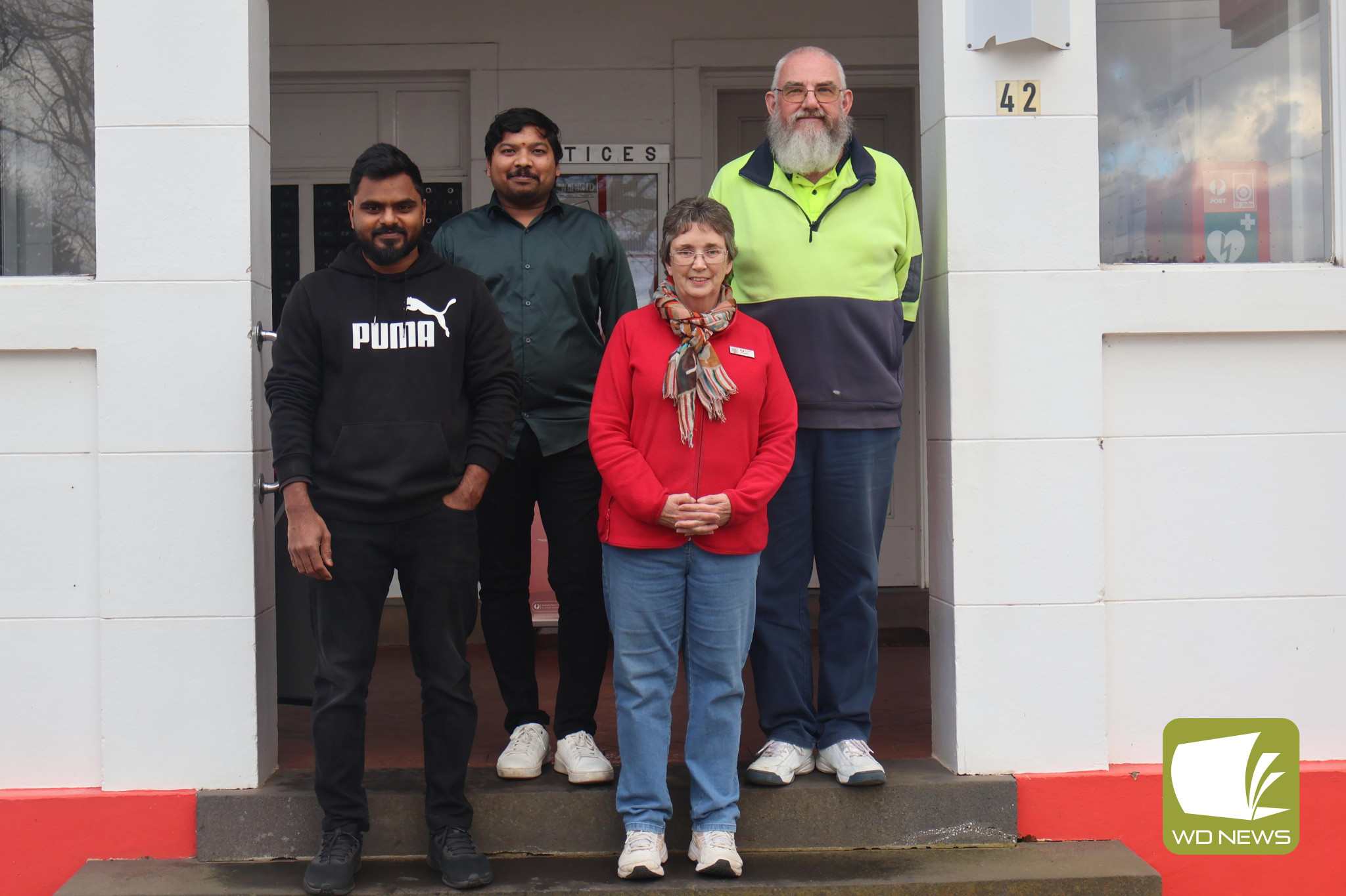 Changing hands: Vinay Parimi (from left) and Jagadeesh Kumar Tubati will be taking over the Derrinallum Post Office from previous owners Margaret and Larry Howard.