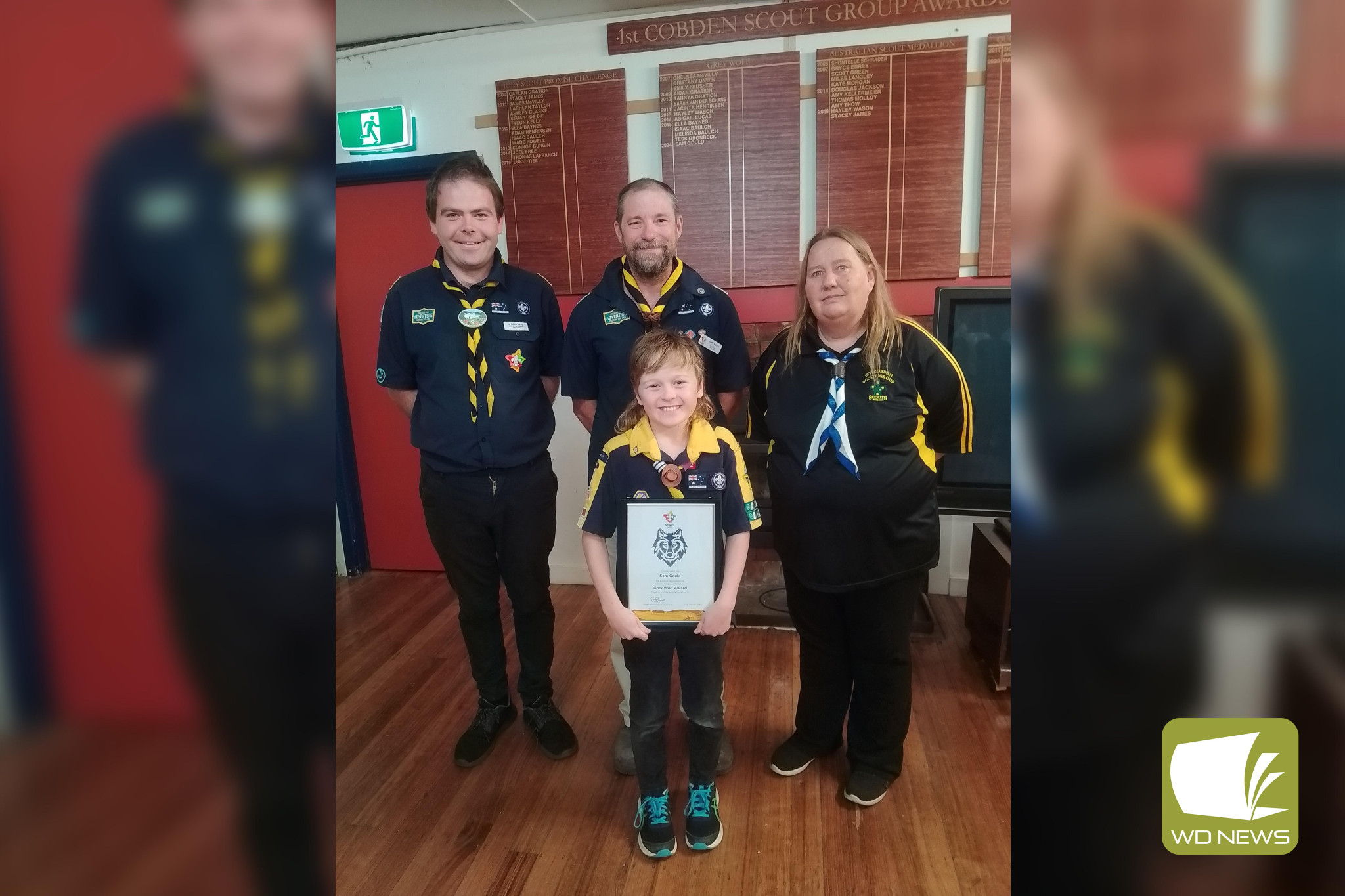 Congratulations: Cobden Cub Sam Gould, pictured with 1st Cobden Scout representatives Justin Keane, John Wason and Mandy Reid, was presented with the Grey Wolf Award recently.