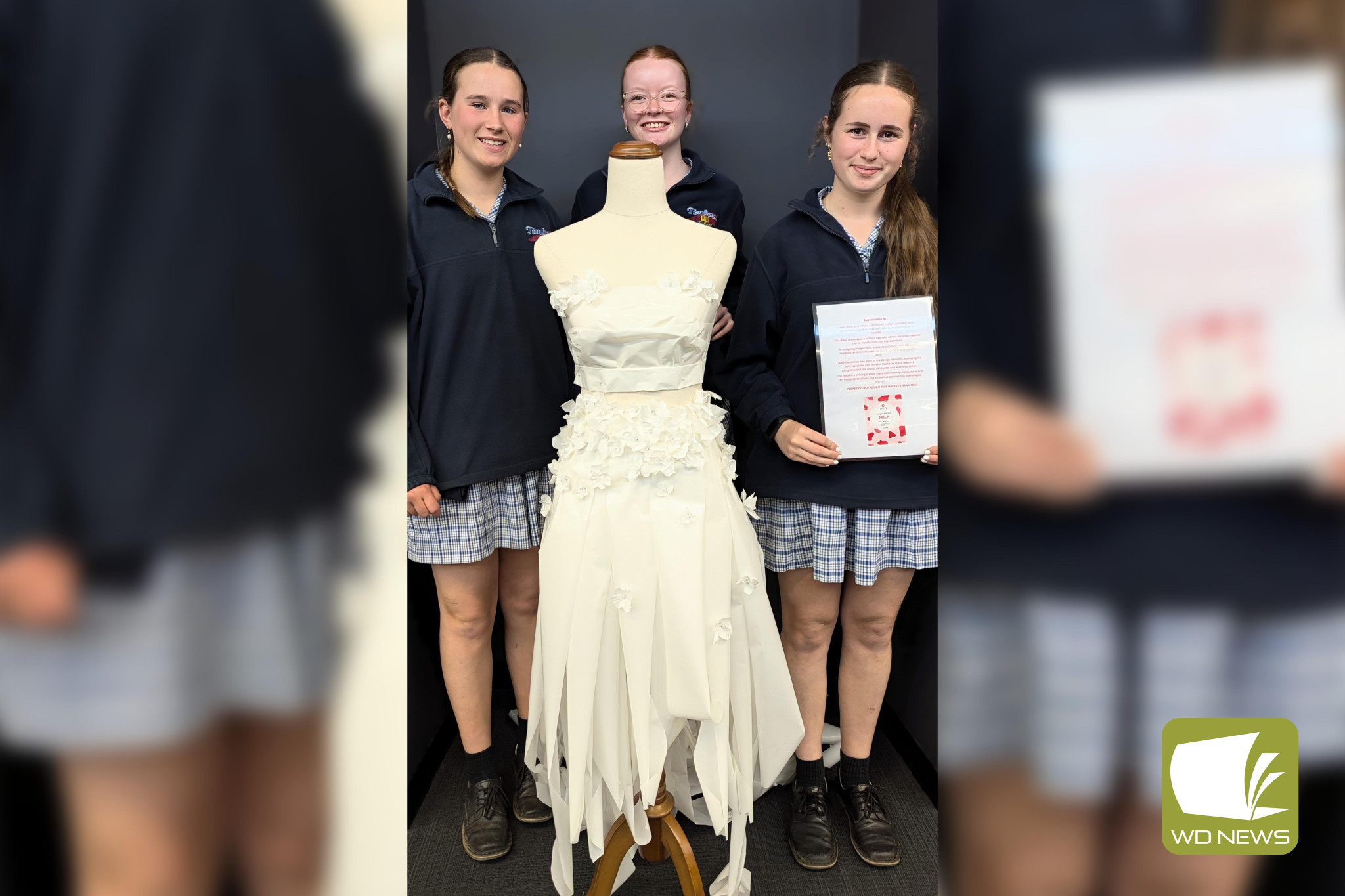 Fashion sense: Timboon P-12 students Asha Loughnan, Ruby Pender and Willow Roberts showed beauty is in the eye of the beholder after crafting a beautiful dress from discarded plastic materials.