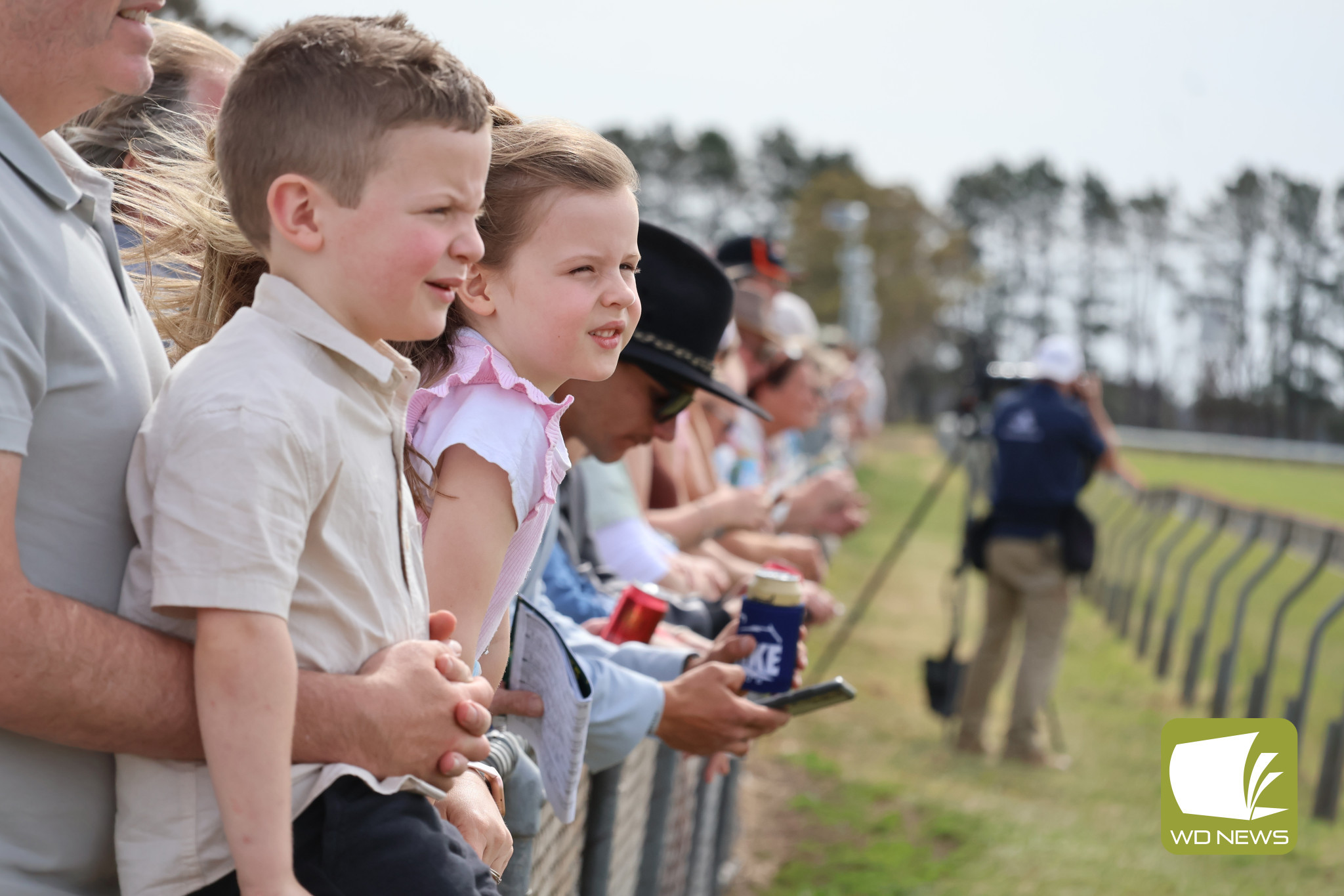 Watching on: Some of the younger patrons enjoyed the spectacle of racing.