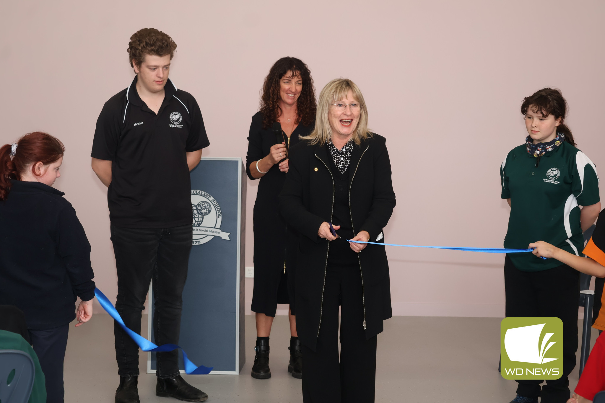 Well deserved: Ms Tierney joined staff, students, stakeholders, friends and family to cut the ribbon declaring Hampden Specialist School’s new campus as officially open.