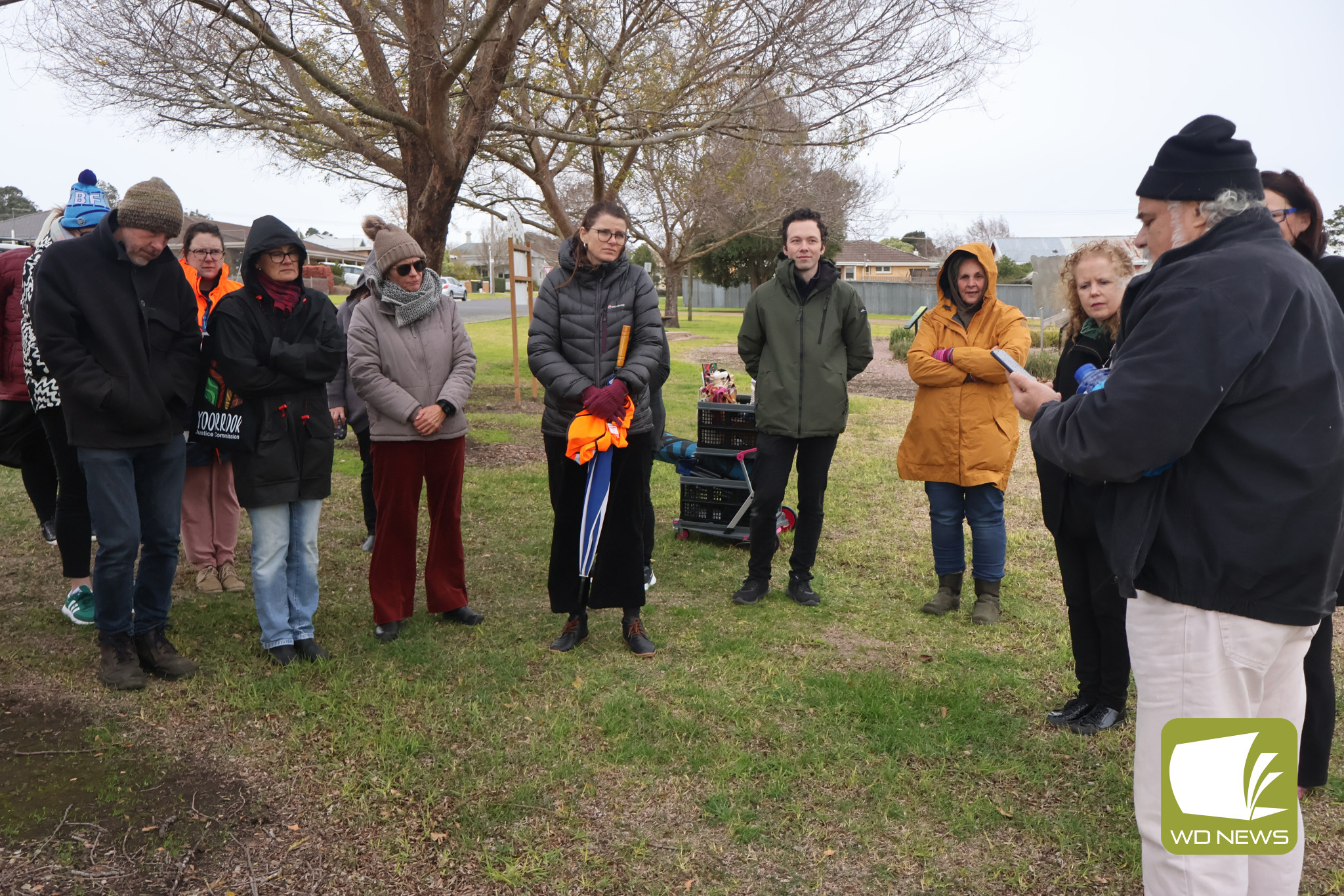 Coming together: The wet, cold and windy conditions did not deter residents from coming together to mark NAIDOC Week.
