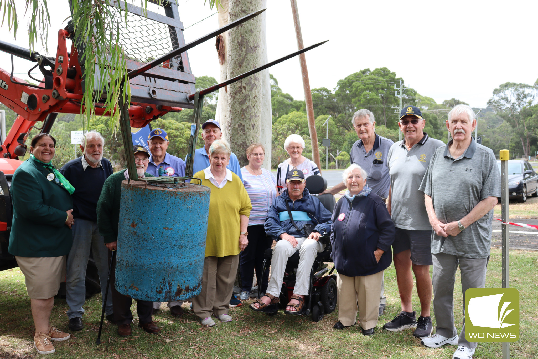 Milestone moment: Timboon Lions Club members gathered for the raising of the time capsule.