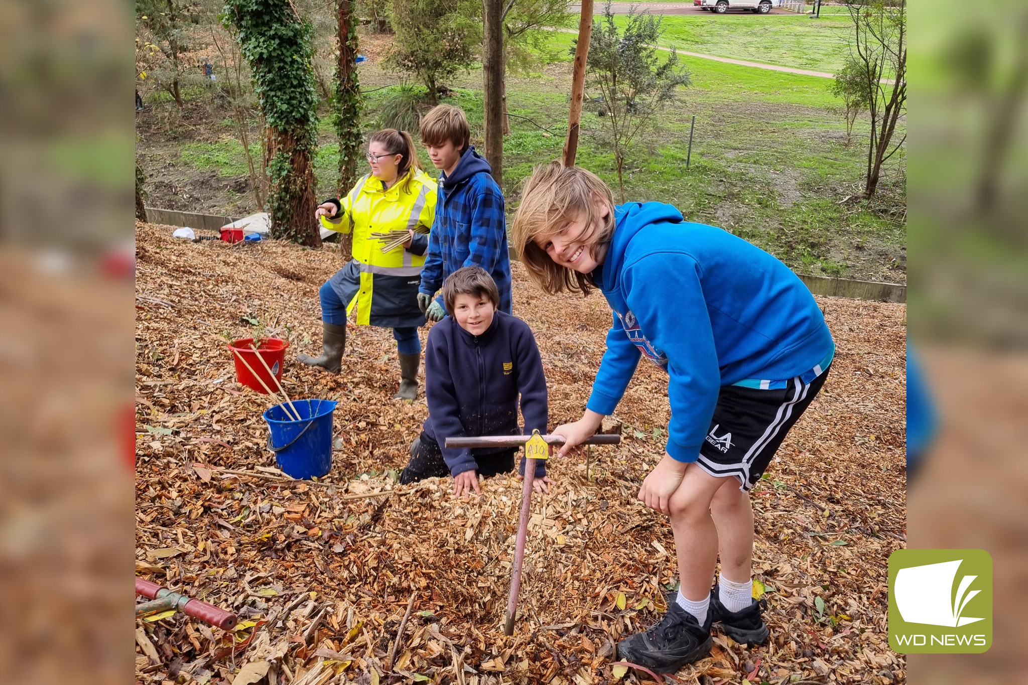 Helping hands: More than 30 members of the community supported HDLN in planting native seedlings at Power Creek this month, helping to revitalise the popular area for all to enjoy.
