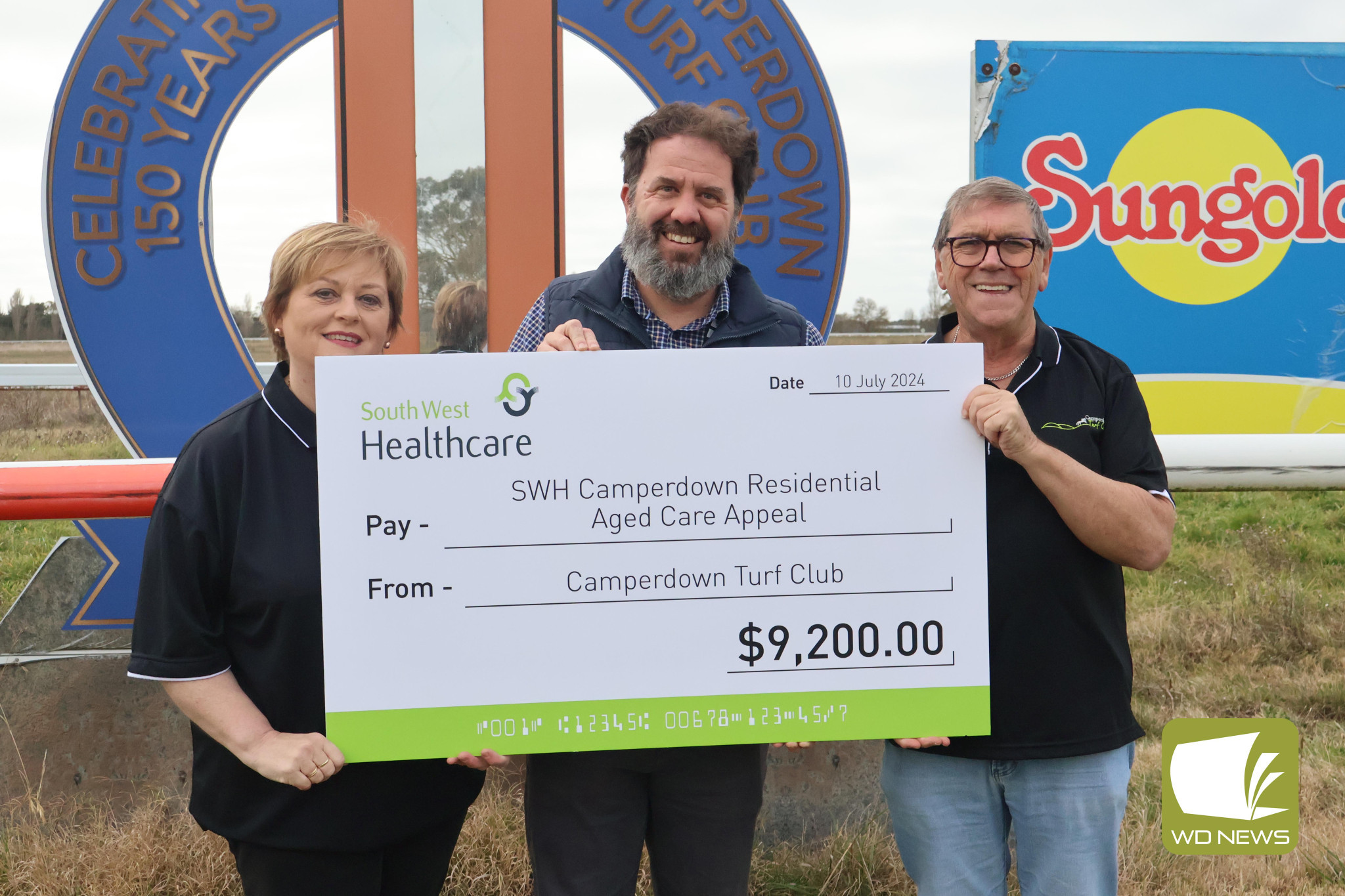 More progress made: Camperdown Turf Club vice president Rose Henry and president Anthony Finn (right) presented South West Healthcare redevelopment and infrastructure executive director Jamie Brennan with a cheque on Wednesday.