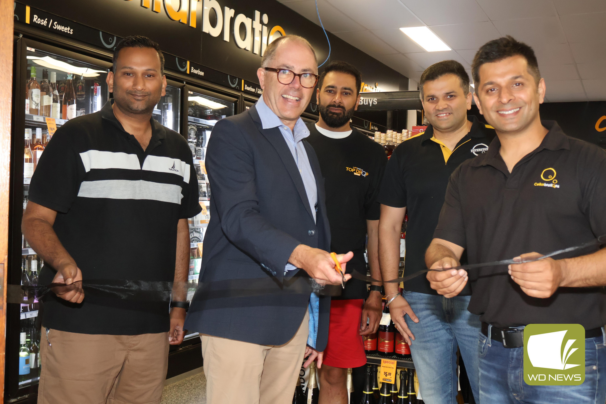 Open for business: Camperdown Cellarbrations held its grand opening last Friday, with Polwarth MP Richard Riordan cutting the ribbon to welcome Sukoon Bedi and his team to town.