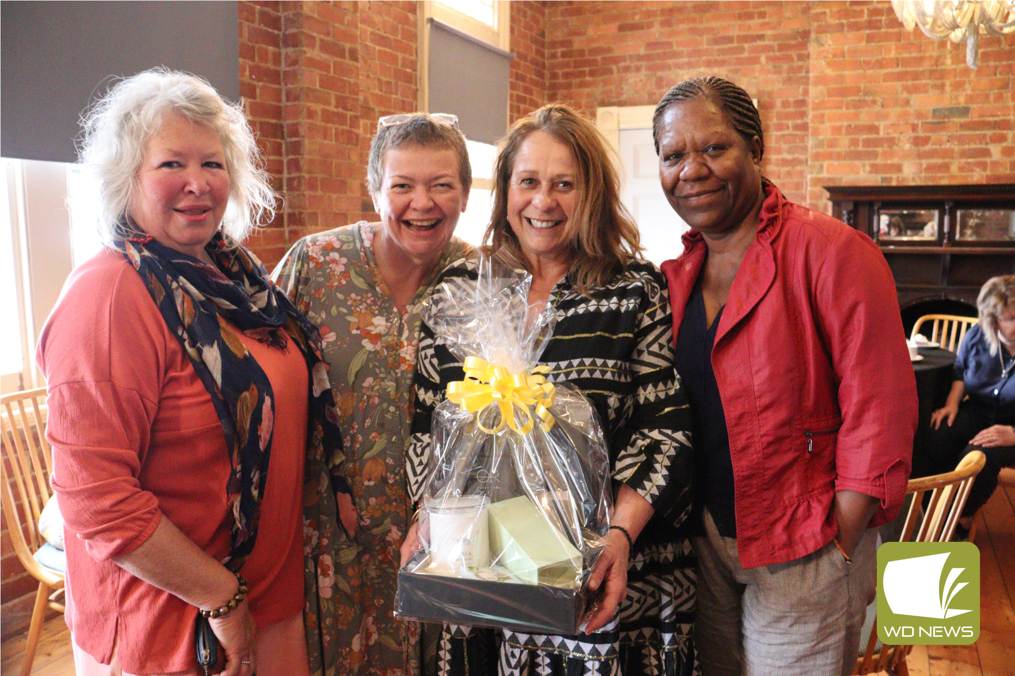 Big winnings: First prize raffle winner Ida Bone (second from right) was delighted by her basket of goodies. She is pictured with fellow Kennedy’s Creek Hall Committee members Glenda Gardener (from left), Chris Shurvell and Freda Reid.