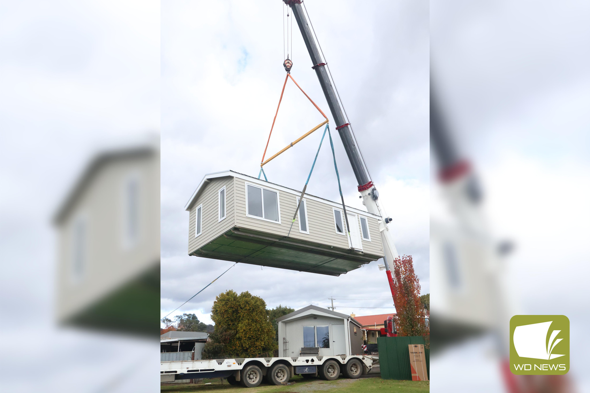 Out of the ordinary: A portable house being installed in a Fergusson Street backyard caught the attention of many Spring Street residents.