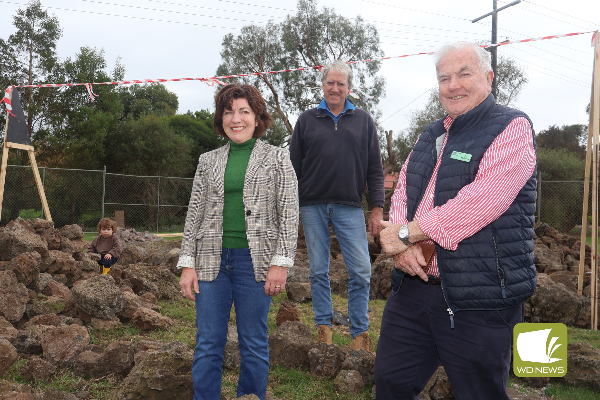 Welcome: Master stonemason David Long has begun laying stone for a new welcome sign in Terang next week, 30 years after building the entrance sign on the opposite side of town. Pictured with Mr Long (centre) is Corangamite Shire councillor Geraldine Conheady and Terang and District Historical Society executive member Des McKinnon.