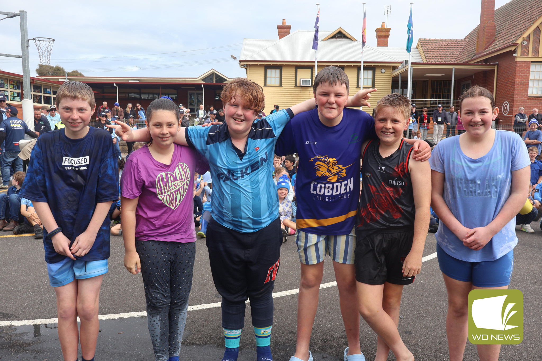 For a good cause: Cobden Primary School students braved an ice bucket challenge last week, which was organised by student Charlie Dunn to coincide with a visit from Daniher’s Drive - a 60 plus vehicle convoy of vehicles travelling across regional Victoria to raise funds and awareness in the fight against Motor Neurone Disease.