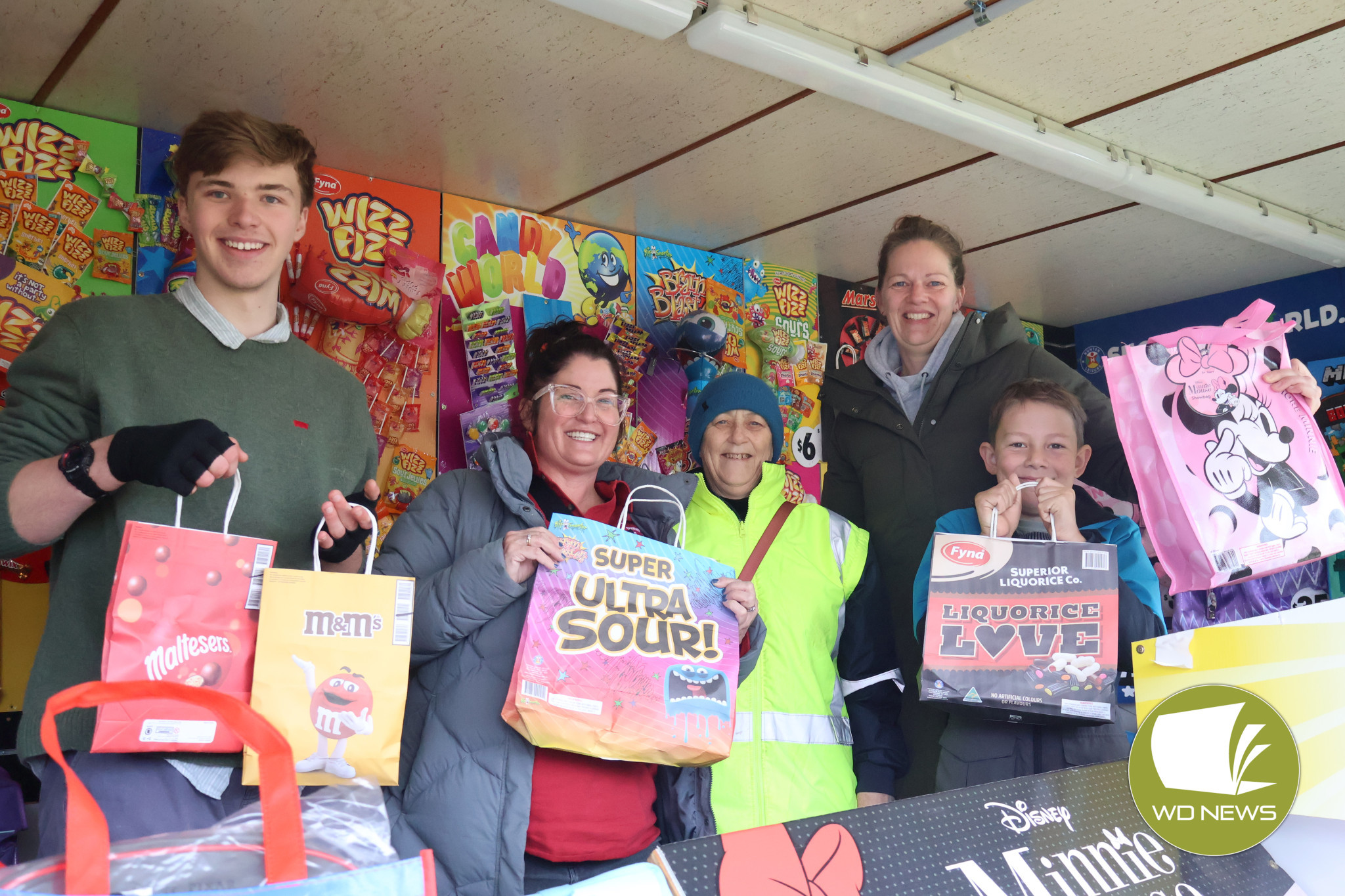 Smiles abound: Showbags proved a popular purchase at the 2025 Community Bank Cobden and Camperdown Camperdown Show as strong crowds turned out despite poor weather.