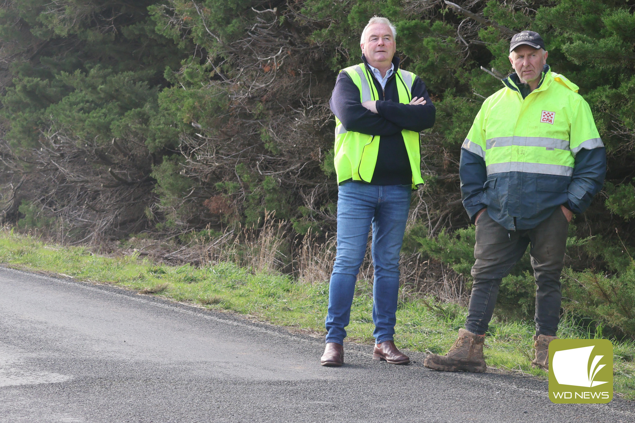 Renewed calls: A rollover on Monday has renewed calls for repairs on the Darlington-Camperdown Road from residents. Pictured is Corangamite Shire deputy mayor Laurie Hickey and Bookaar CFA volunteer Andrew Duynhoven.