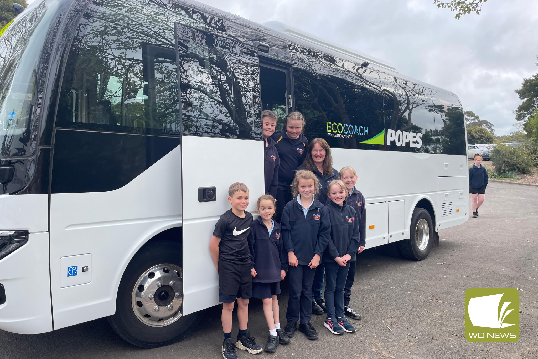 Test drive: Timboon P-12 School students are among the first to try a new electric bus which is being trialled at Popes Timboon, pictured with bus driver Cherine Benallack.