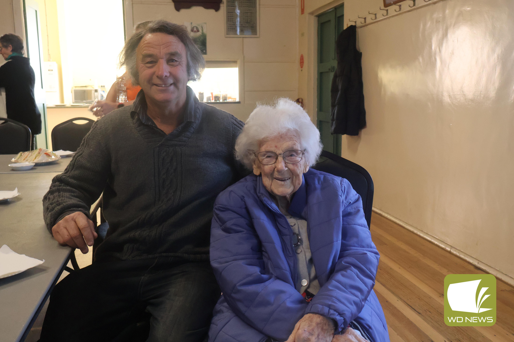 Going strong: Margaret Toulmin (right, pictured with Geoff Bennett) is still getting out and about at 103.