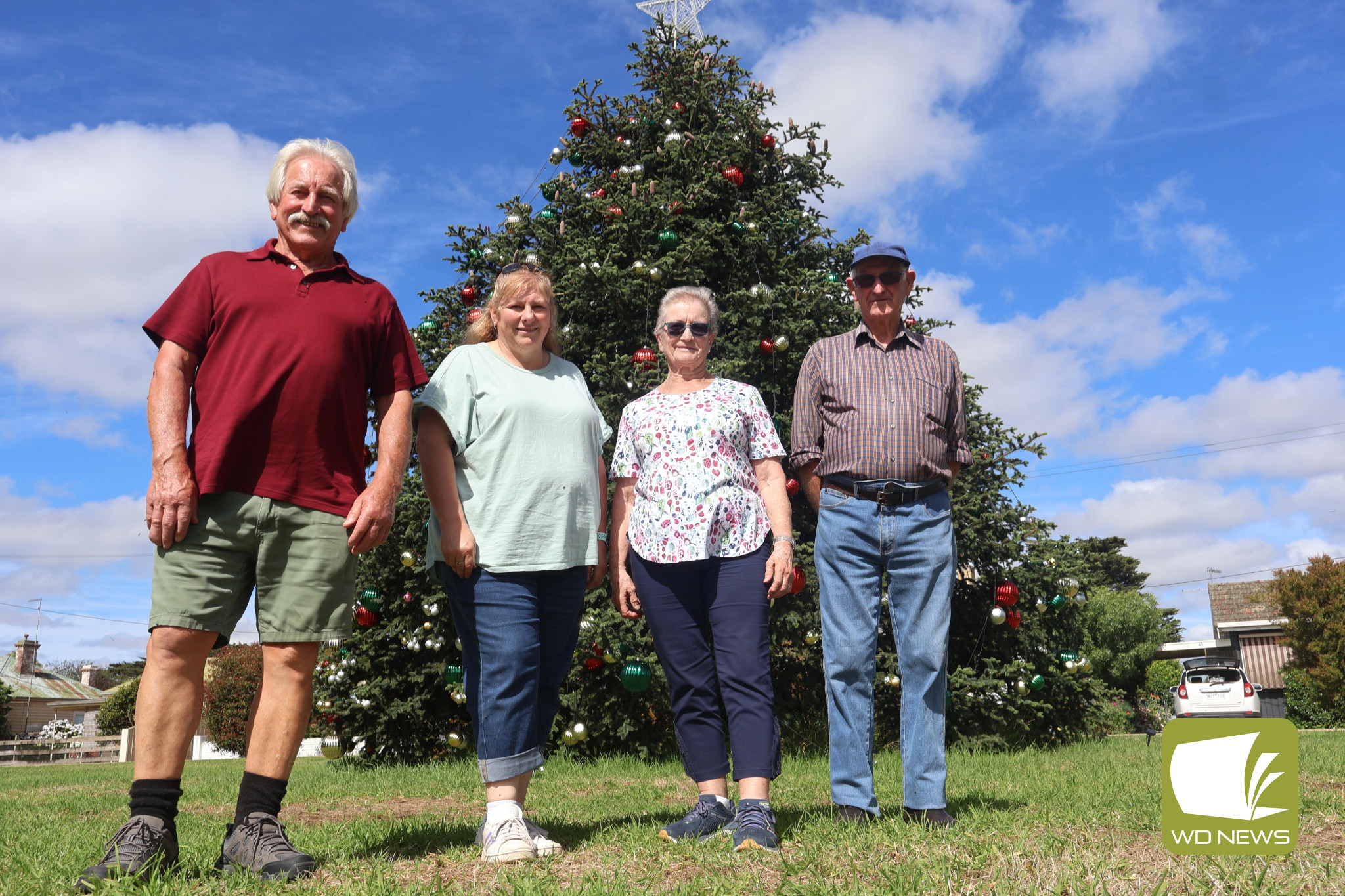 Merry Christmas: After more than 20 years, a Christmas tradition which began in the backyard of the Porter family home has grown to become a new tradition for members of the Noorat community to usher in the holidays. Pictured are family members Brian Porter, Kate McIntosh, Joan Graham and Robert Porter.