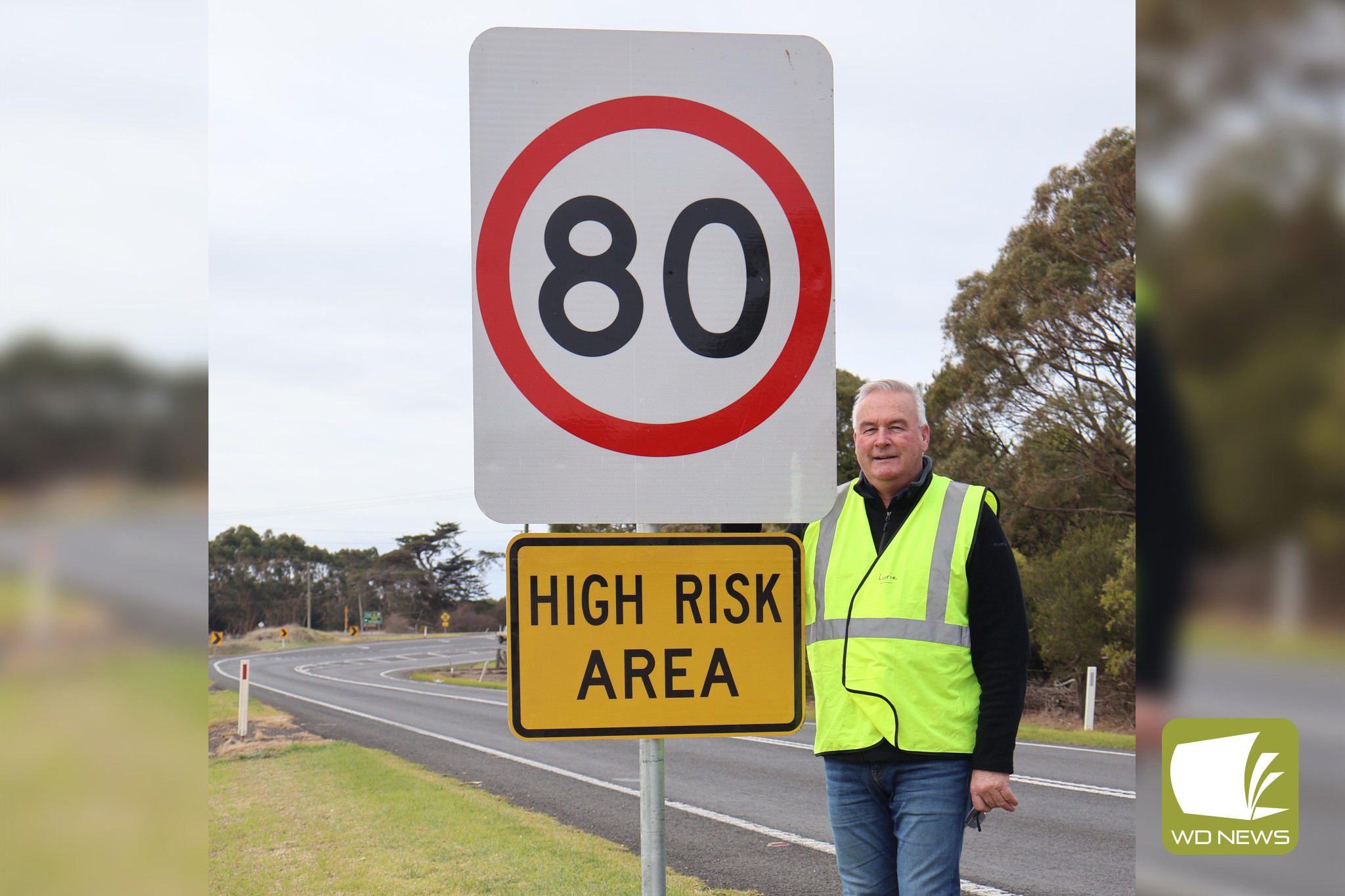 Finally: Corangamite Shire councillor Laurie Hickey with one of the new 80km/h signs at the Gnotuk corner, which will improve safety for those entering the highway.