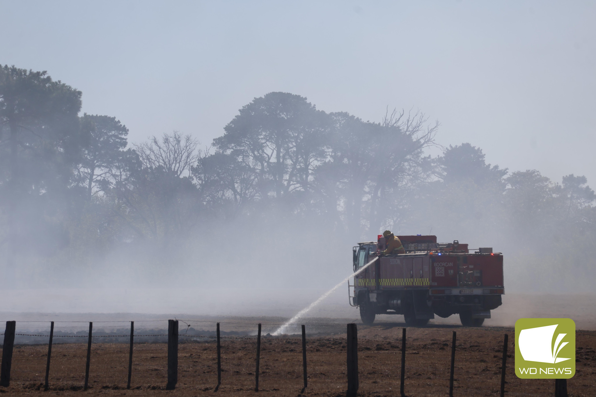 Teamwork: CFA crews worked to extinguish a grass fire along the Darlington-Camperdown Road in Bookaar last Thursday afternoon.