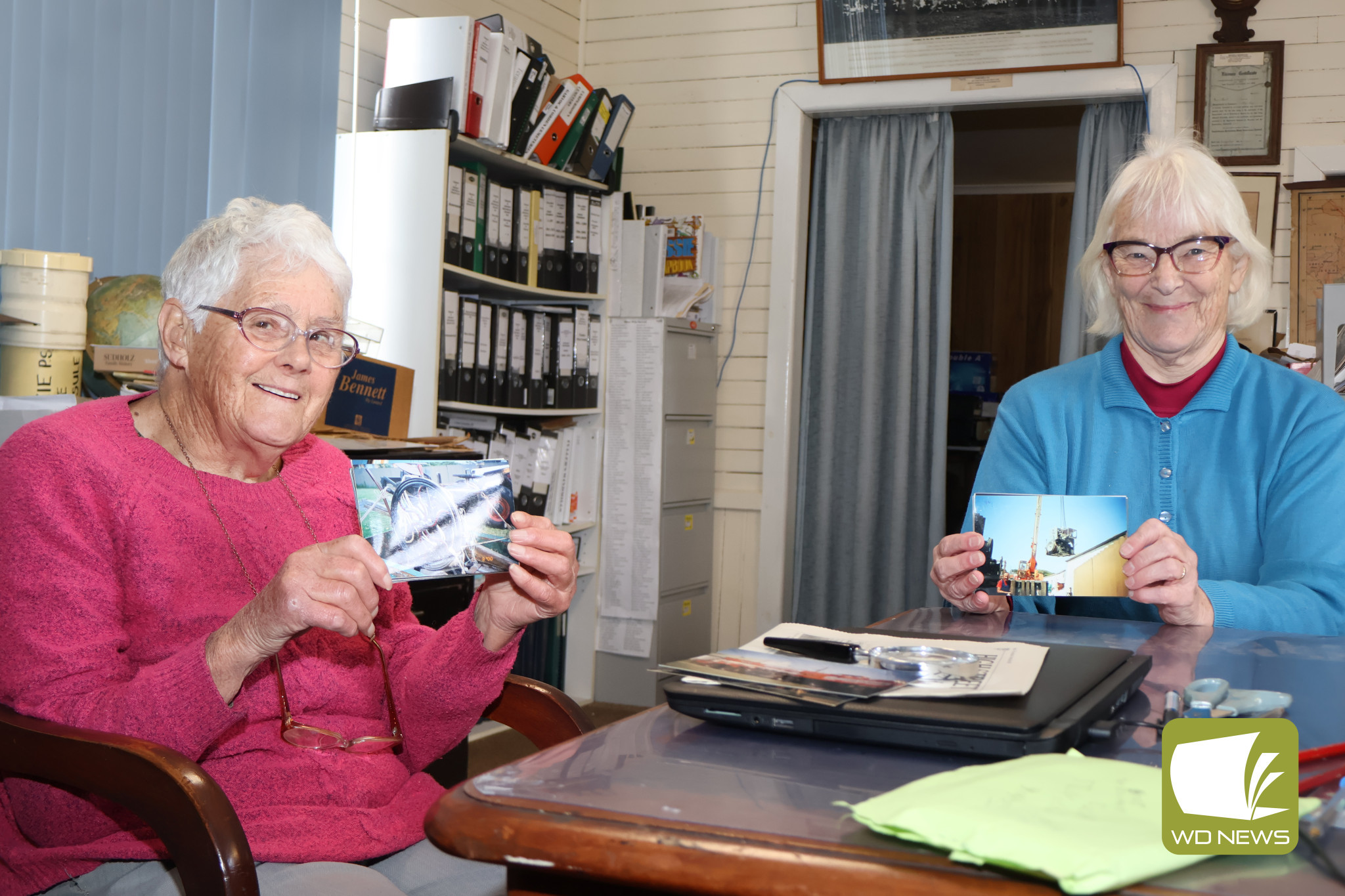 Missing history: Margaret Parnell (left) has donated around 50 photographs to the Terang and District Historical Society showing the final days of the old Terang Express office on Bayne Street. She is pictured with Terang and District Historical Society research officer Margaret McIntosh.