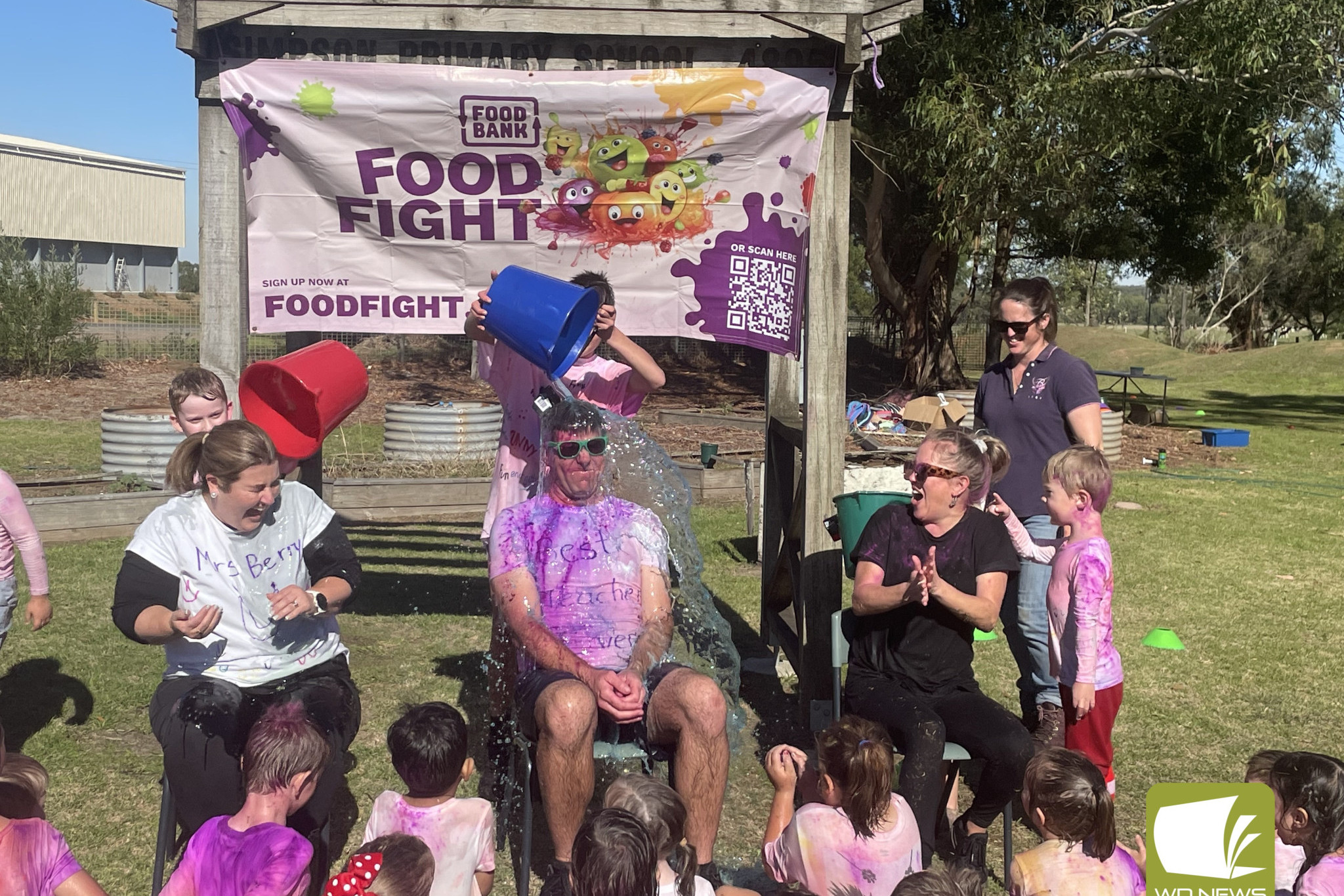 Oh dear: Simpson Primary School staff members were slimed for a good cause at Foodbank Food Fight on Monday.