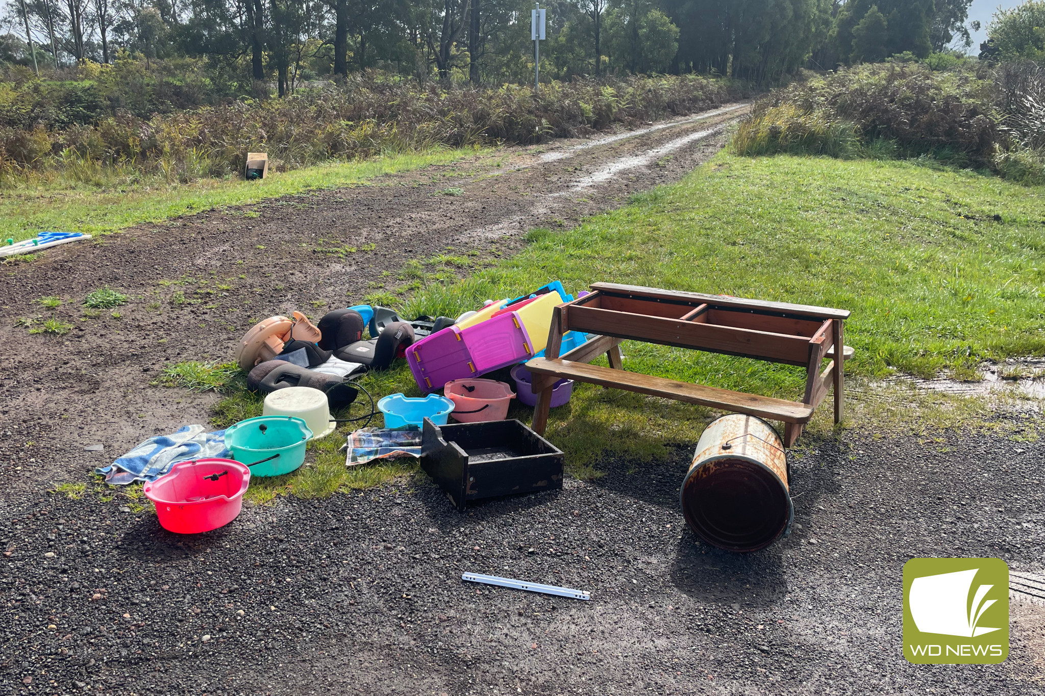 Low act: Rubbish callously dumped on the Camperdown-Timboon Rail Trail at Elingamite has frustrated hardworking volunteers.