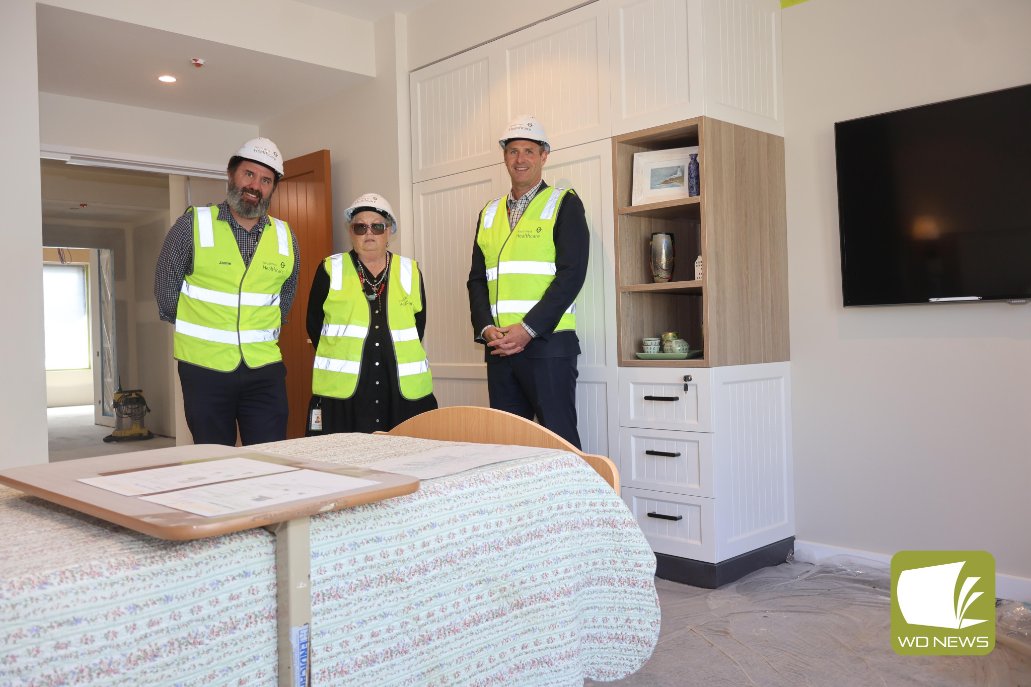 Under construction: South West Healthcare executive director of redevelopment and infrastructure Jamie Brennan, project manager aged care redevelopment Janine Dureau-Finn and chief executive officer Craig Fraser were among the staff to view the new prototype room, the first room built as construction progresses on the $39.6 million redevelopment of Camperdown’s Merindah Lodge.