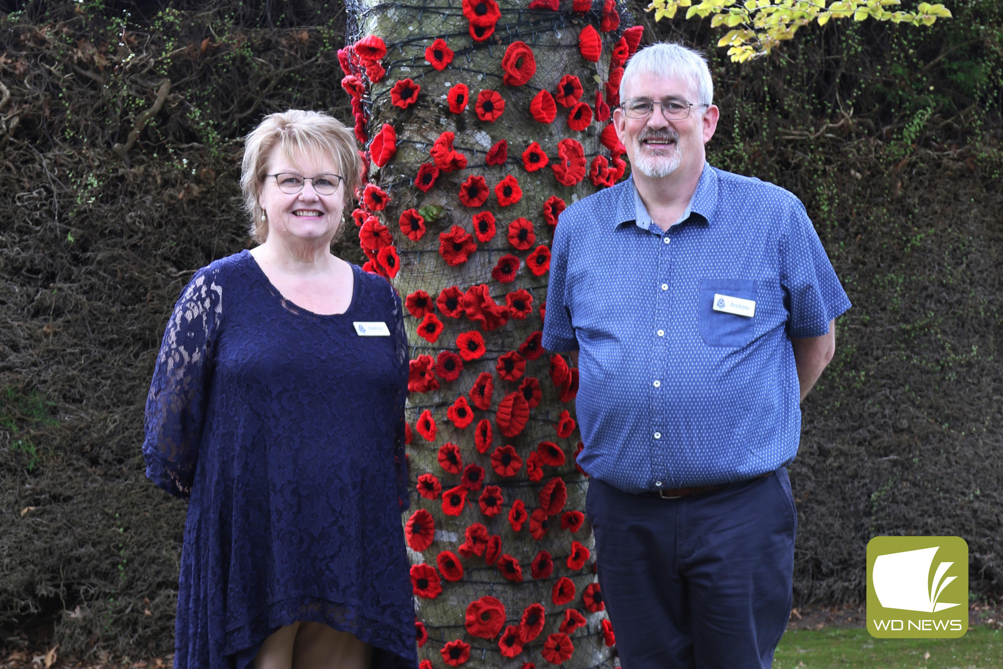 Heytesbury House owners Kathryn and Andrew Stubbings with the poppy tree which was showcased at their recent open day. Photo supplied by Wendy Bernhardt