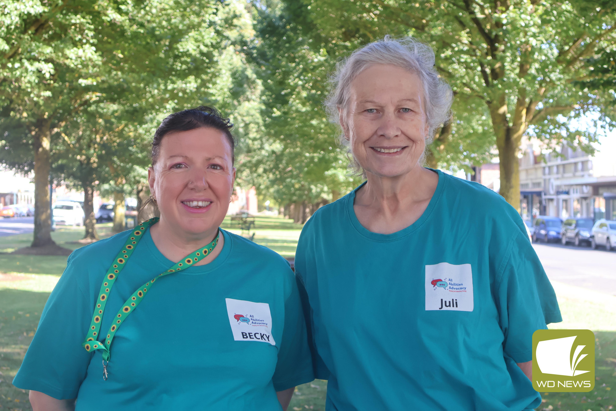 Raising awareness: All Abilities Advocacy leadership team member Beck Biddle and project worker Juli-Anne Grauer are encouraging residents to learn more about sunflower lanyards to raise awareness of hidden disabilities.