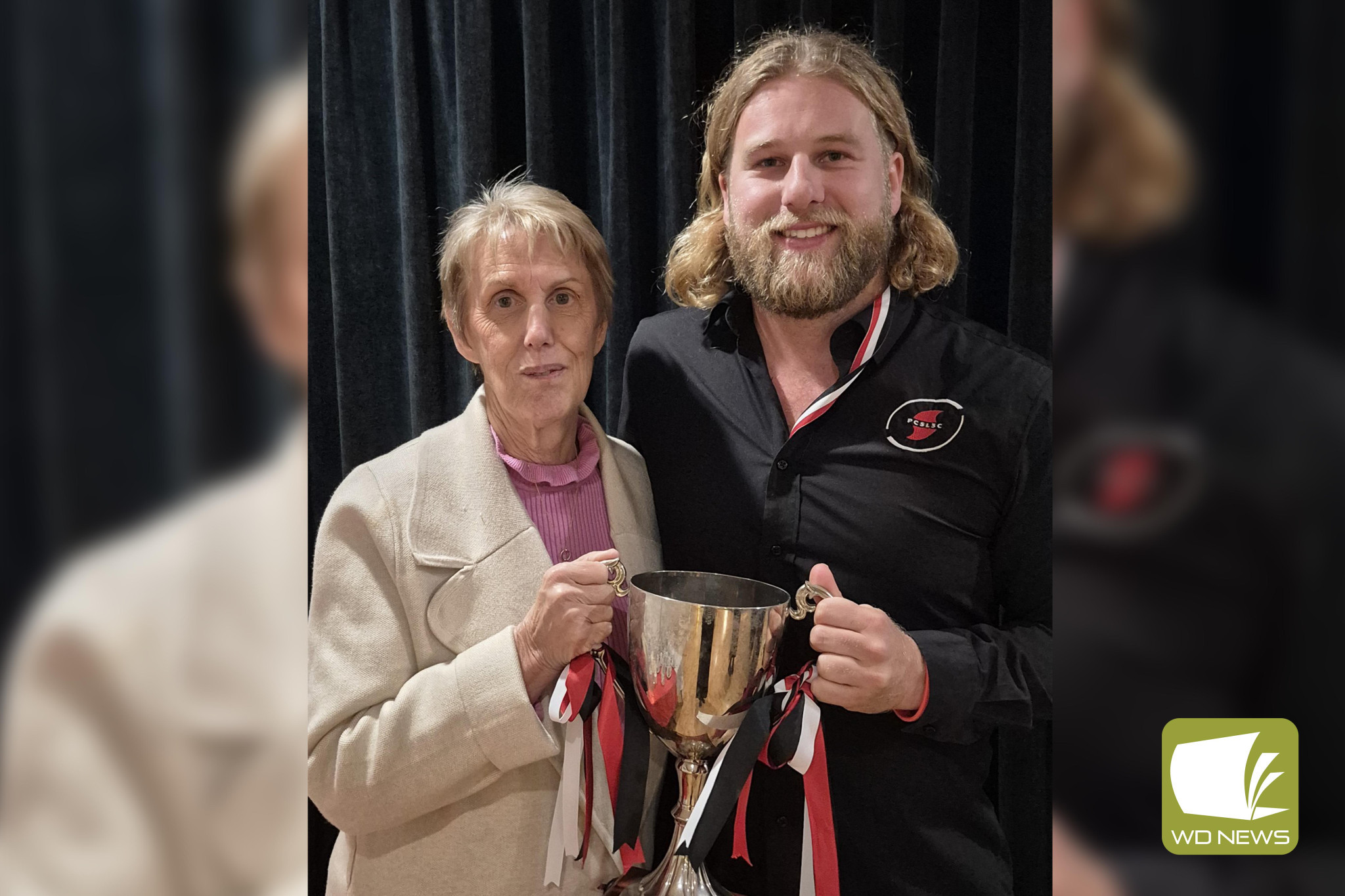 Award recipient: Darcy Tribe (right) of the Port Campbell Surf Lifesaving Club won the Stewart Meek Most Passionate Club Person award. He is pictured with Kaye Meek.