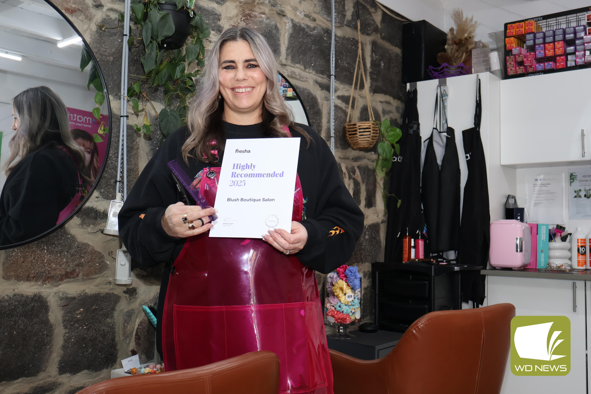 All smiles: Blush Boutique senior stylist Naomi Gibbs was thrilled to receive an award of recommendation for client satisfaction.