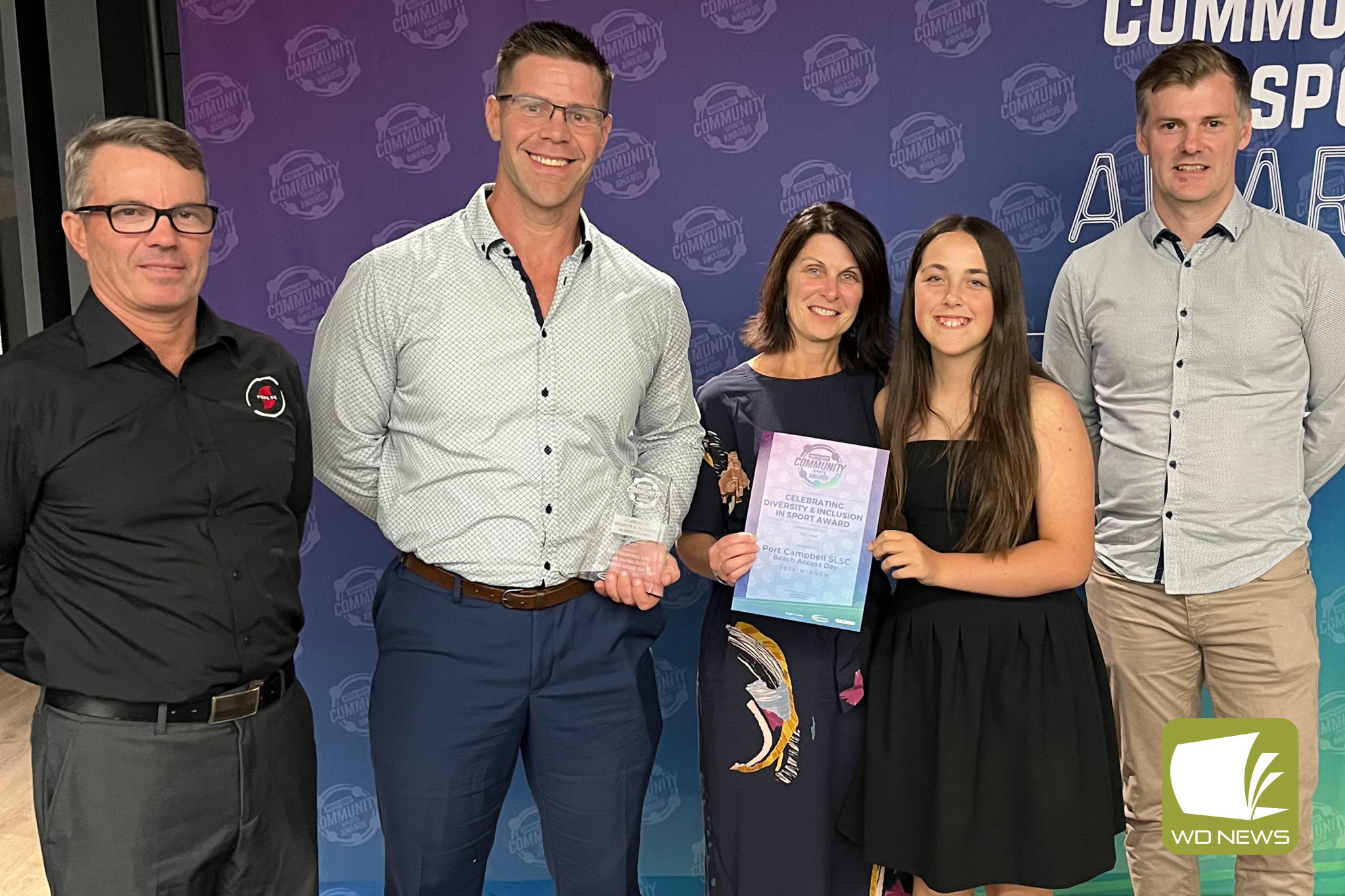 Representatives from the Port Campbell Surf Life Saving Club with their award for ‘Celebrating Diversity and Inclusion in Sport.’