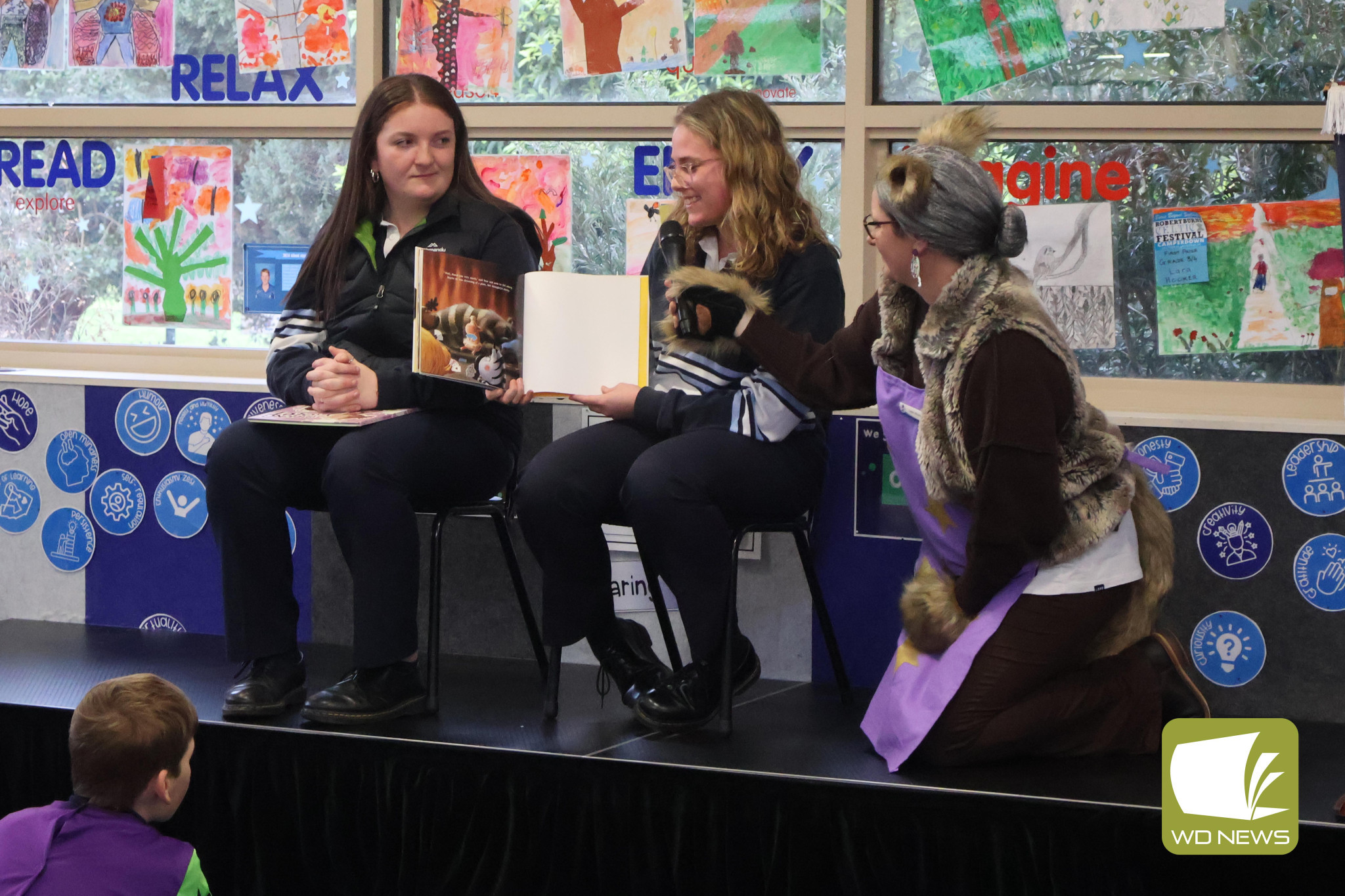 Sharing books: Camperdown College senior school captains Riley Stephenson and Ebony Pearce shared their favourite books with the junior campus.