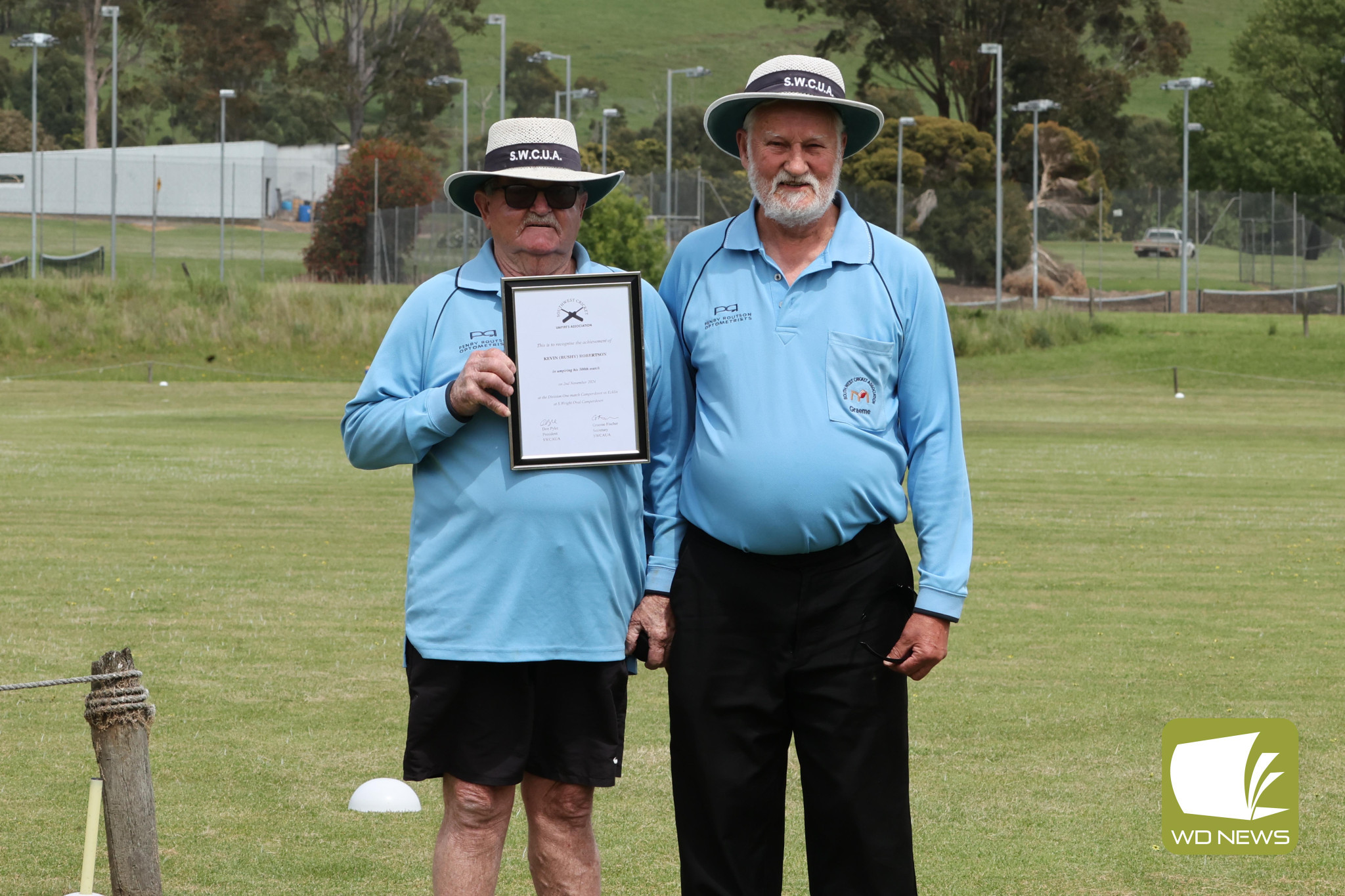 Kevin, ‘Bushy’ Robertson, pictured with South West Cricket Associations Graeme Fischer, notched up his 500th game as an umpire.