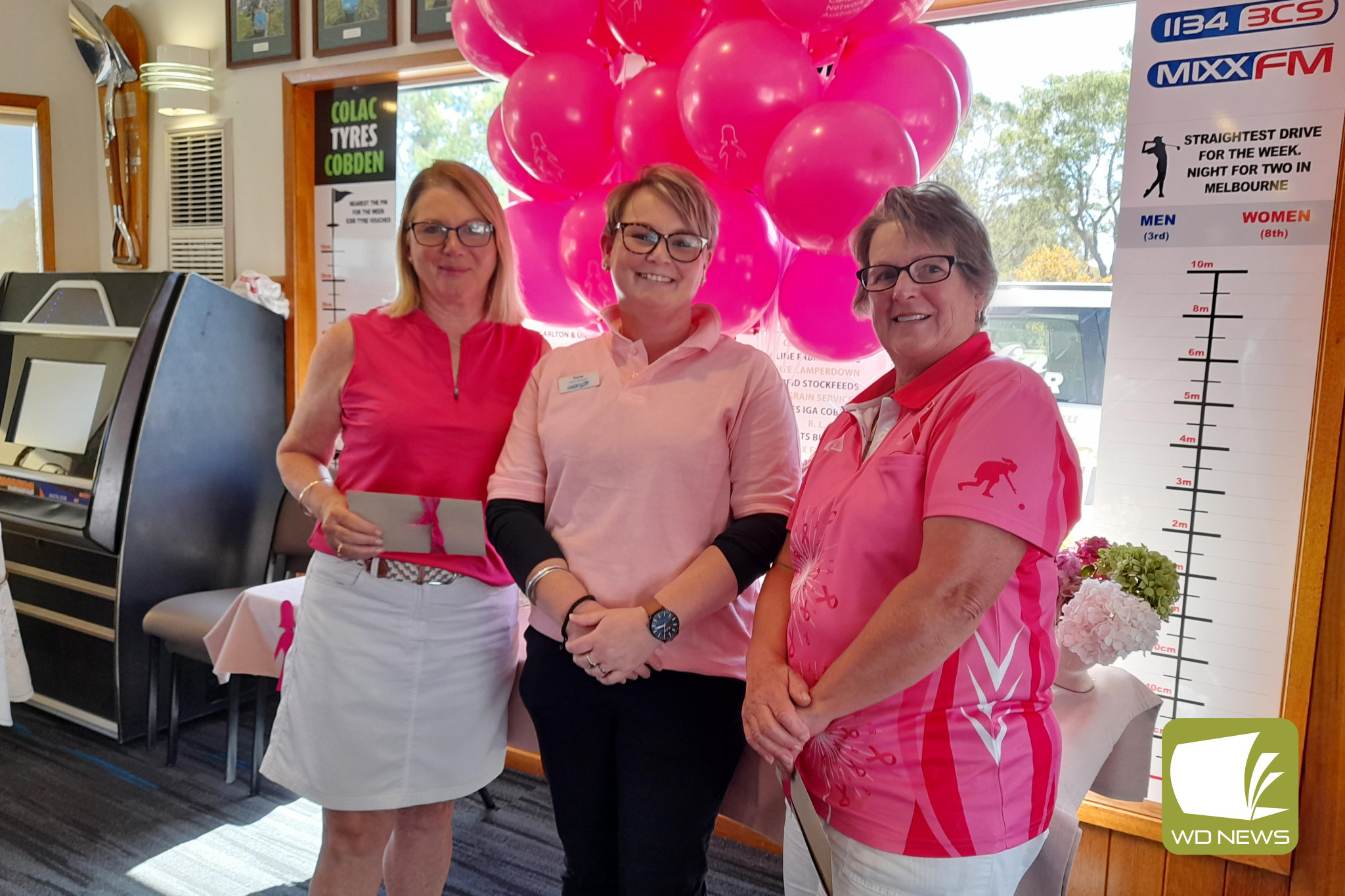 Winners of the 4BBB stableford, Deb Ferrari (left) and Carmel Darcy (right) are congratulated by Fiona Gee from the Cobden Pharmacy.