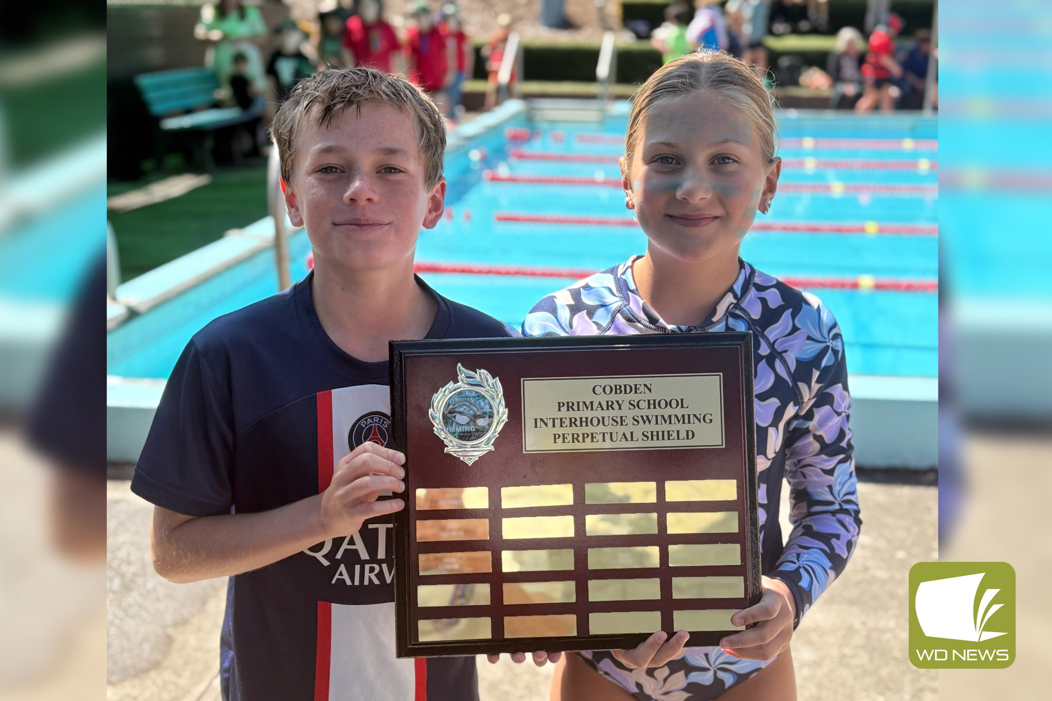 Curdie House captain Mahli Baxter and vice-captain Jett Daffy accept the winning shield.