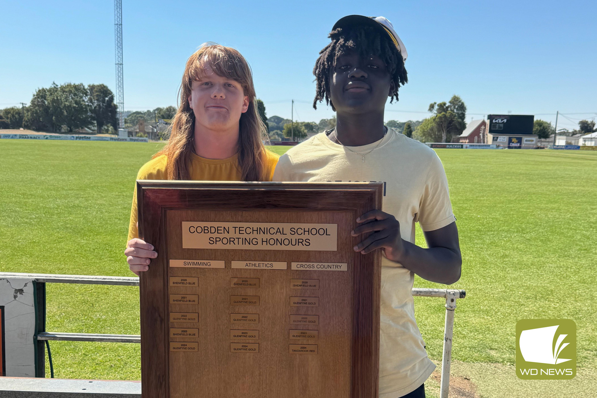 House captains Adam Jopling and Felix Nguena Nguena accept the shield on behalf of winners, Glenfyne.