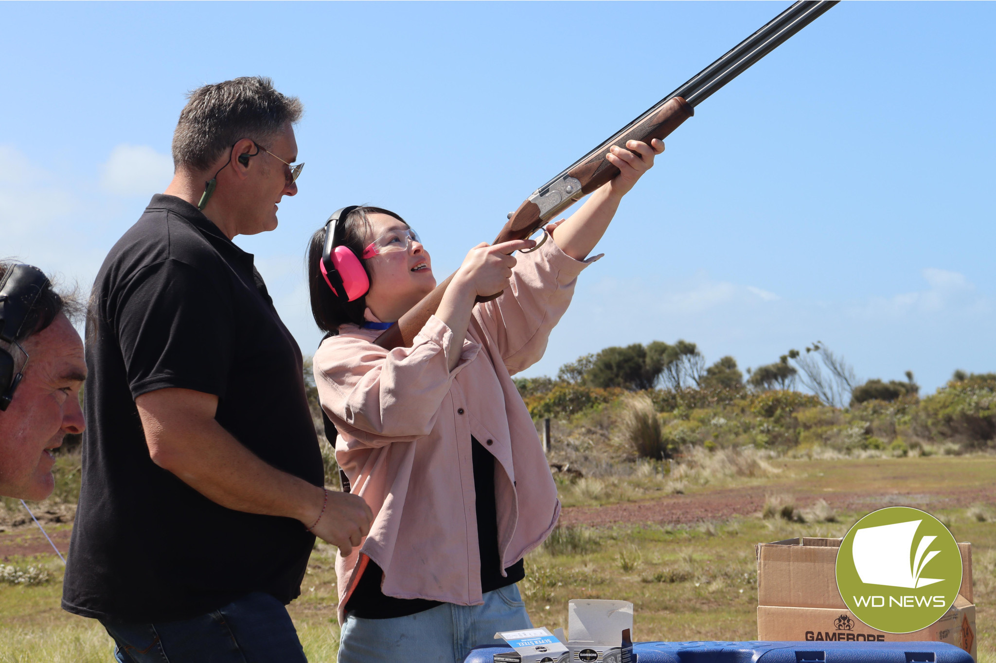 Focus: Wayne Lording guided Girls with Guns attendee Yichien Lee to shoot moving clay targets with a shotgun.
