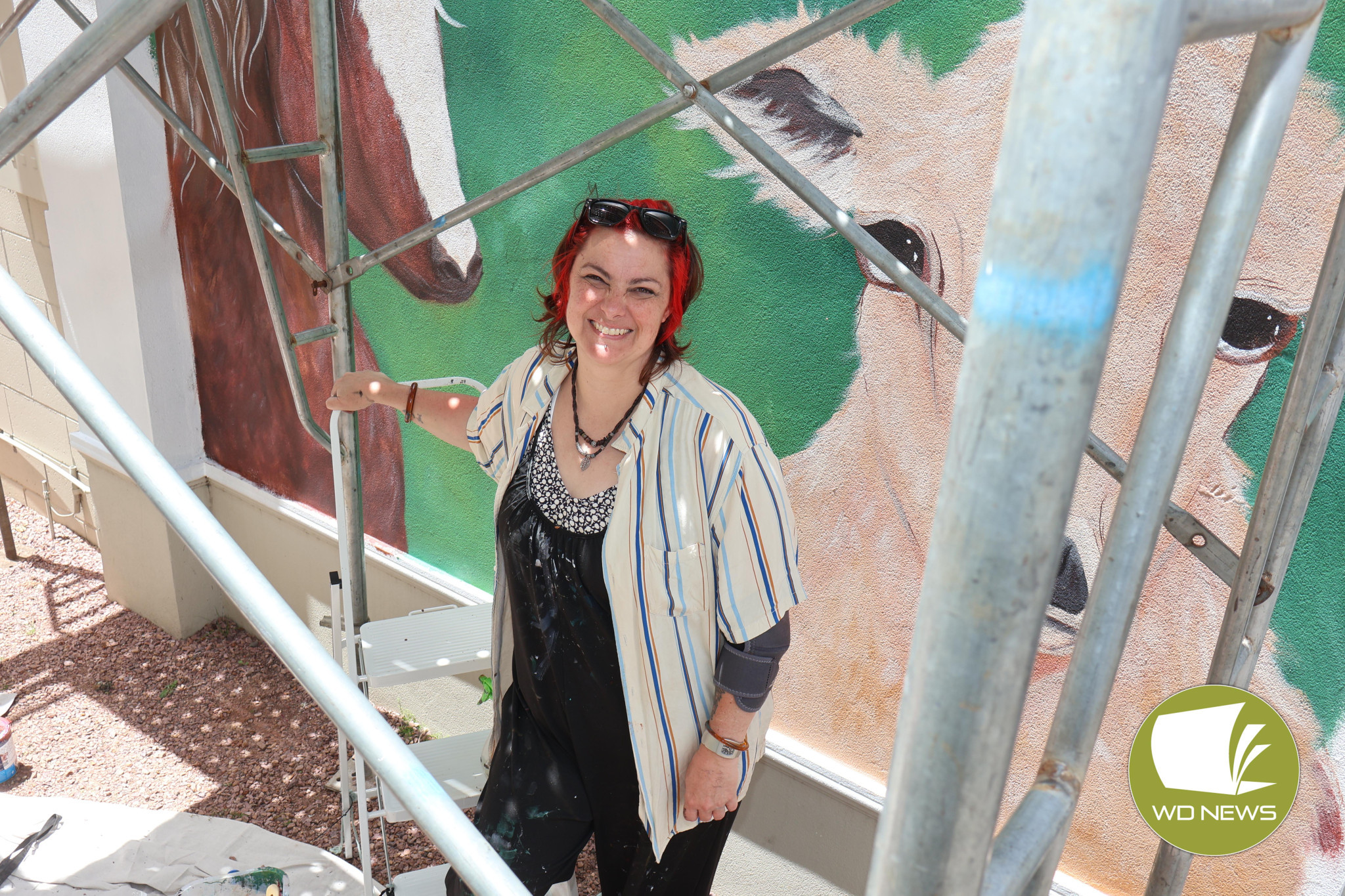 Vibrant: Artist Jess Fowler has begun work on a new mural which captures the essence of Terang’s business and agricultural history.