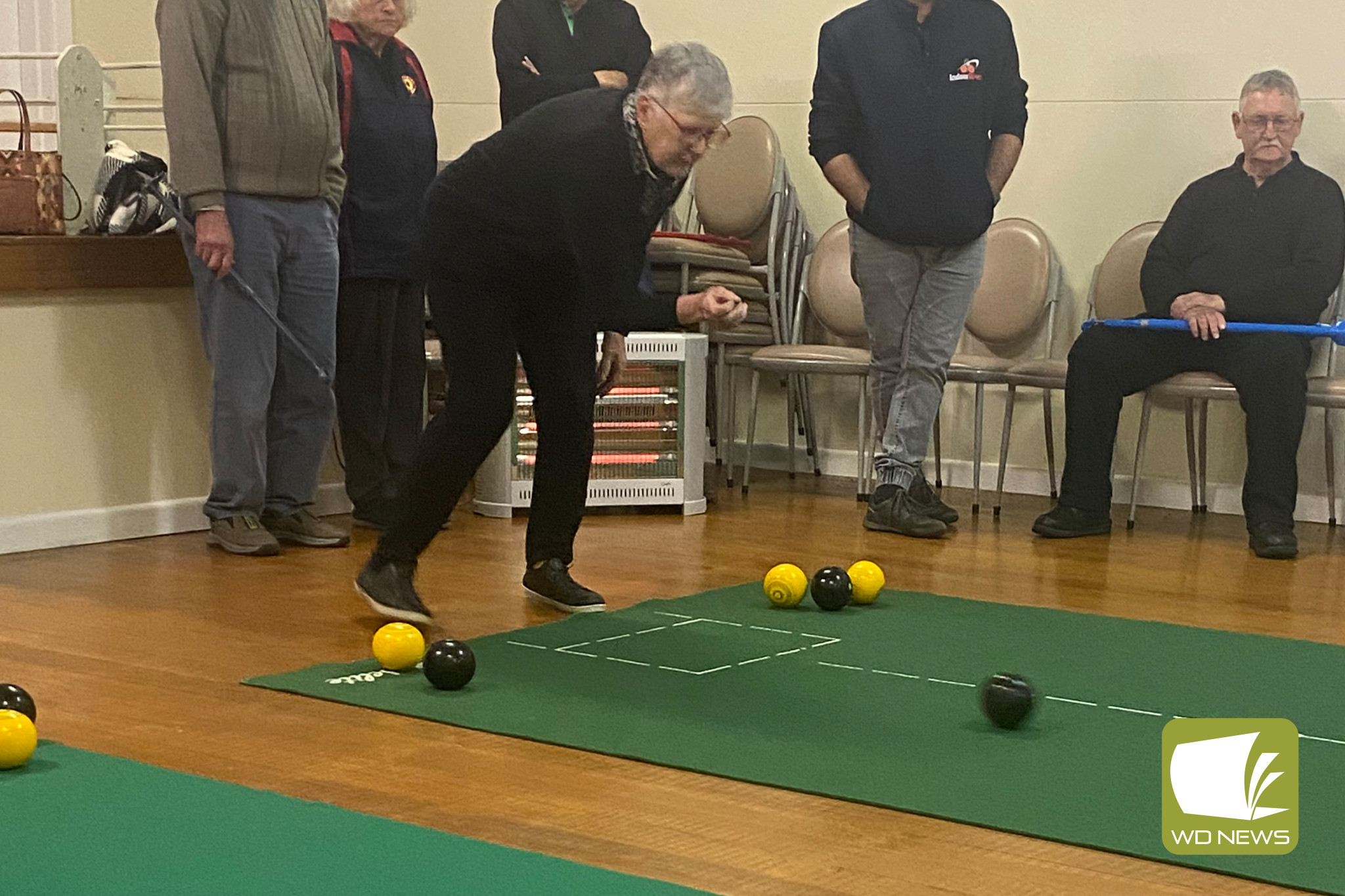 In Division 3, Cobden 3 Third Kath Spokes delivers her bowl as everyone watches on in the match against Mepunga 4.