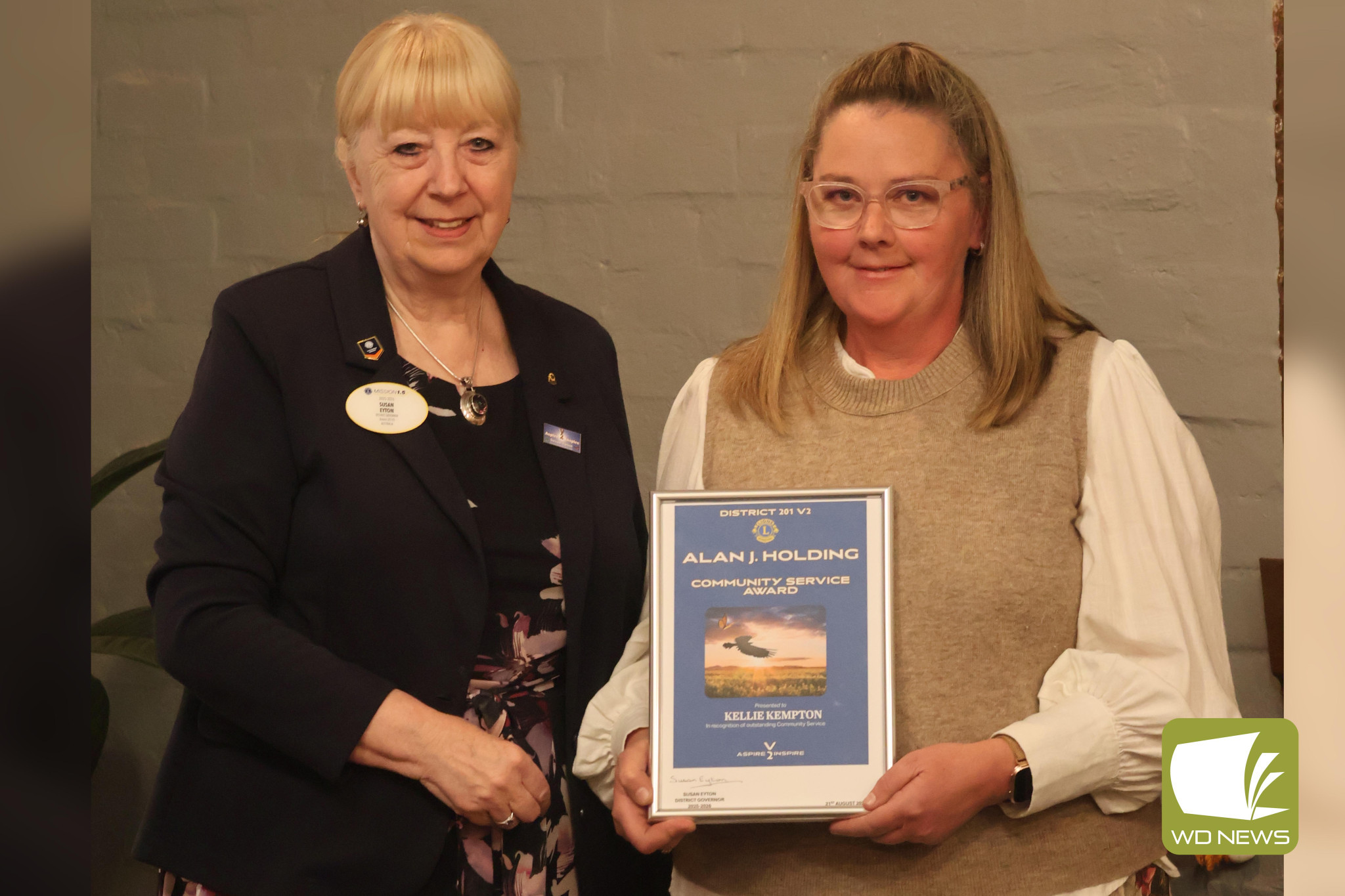 Work recognised: Lions district governor Susan Eyton (left) presented Kellie Kempton with an Alan J Holding award at a dinner meeting last Thursday.