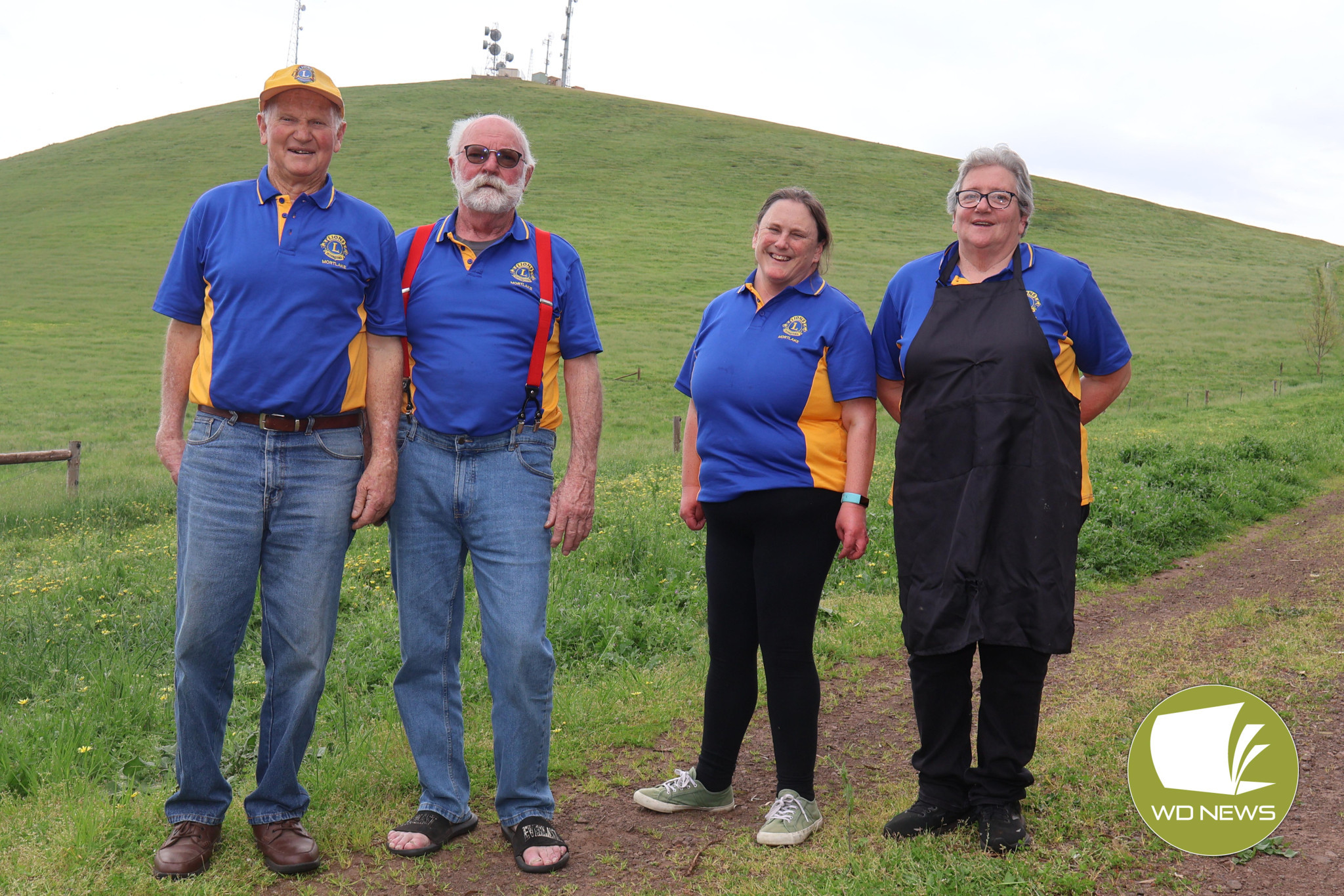 A long way up: Mortlake Lions Club members Alex Hinkley, Leigh Buesnel, Annie Palmer and Lynda Hubbard were all smiles greeting walkers making the trek up Mount Shadwell on Sunday.