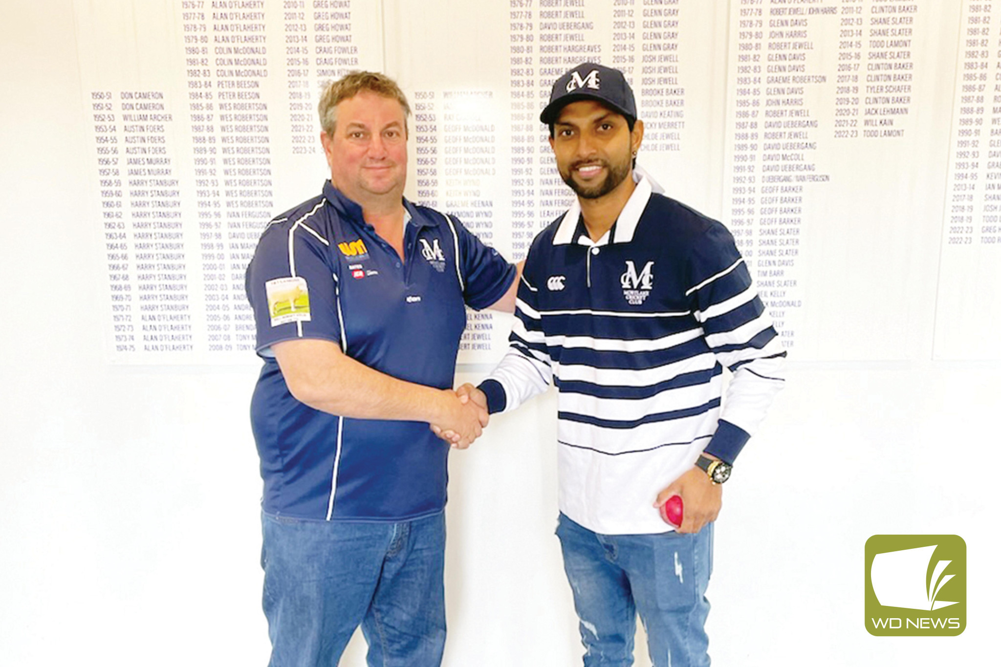 Mortlake Cricket Club president Simon Ritchie welcomes Kalhan Sineth to the Cats.