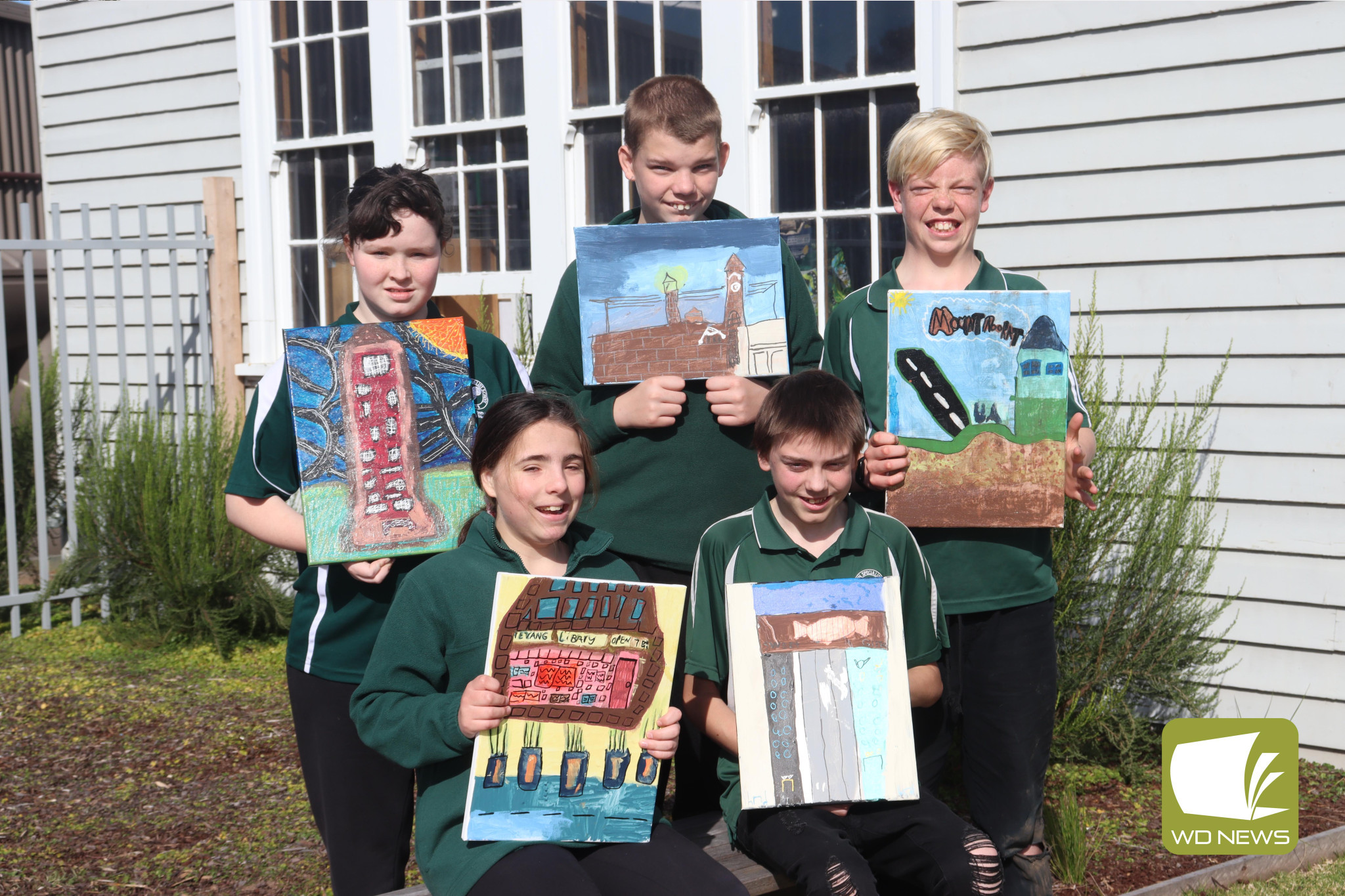 Getting creative: Gabrielle Scott (back left), Izayah Dixon, Jesse Smith-Watts, Mackenzie Gurry (front left) and Caleb Rogers painted pictures of locations from across Corangamite Shire for the Paint the Shire exhibition, which is currently on display at the Cobden Visitor Information Centre.